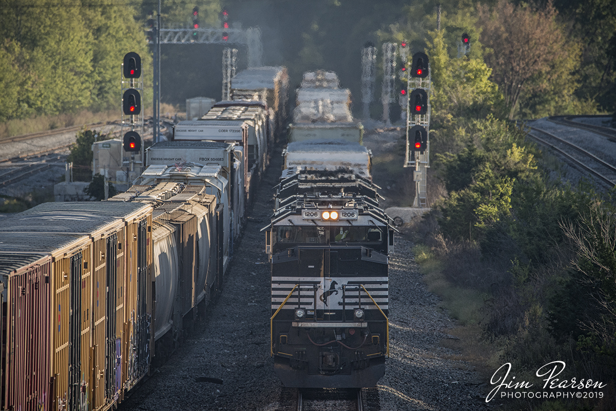 September 22, 2019 - Norfolk Southern 1206 heads south into DeButts Yard with it's mixed freight at Chattanooga, Tennessee as a northbound freight departs.