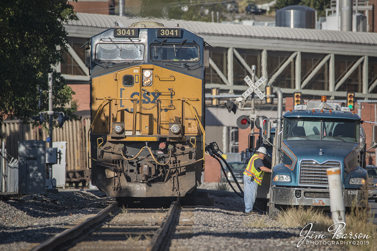 October 5, 2019 - A Loaded E319 takes on fuel on Ohio Street, just north of Howell Yard in Evansville, Indiana as a Evansville Western Railway crew brings it off their line. Their train it will be tied down in the siding at Harwood, on the Evansville Terminal Subdivision, as it waits for a fresh crew that will take it on north as a N319 (N319 Evansville, IN (EVWR) - Cross, SC). Most coal trains head south from Evansville, but I'm told that some have started going north, bound for the east coast for export overseas. Not sure if they're being rerouted due to weather or construction.