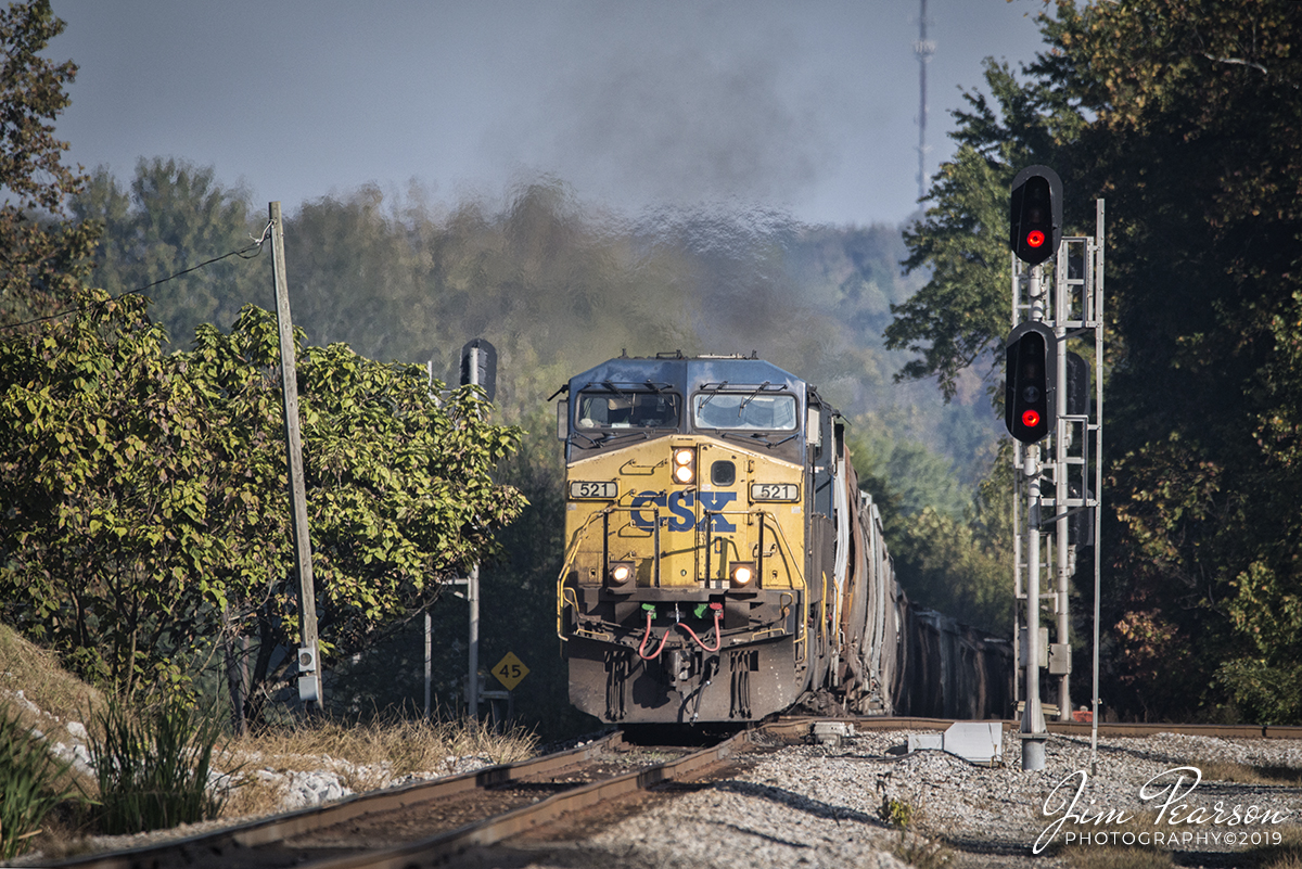 October 8, 2019 - Loaded grain train CSX G307 pulls through the Mortons Junction switch as it heads south on the Henderson Subdivision at Mortons Gap, Ky with CSXT 521 leading.