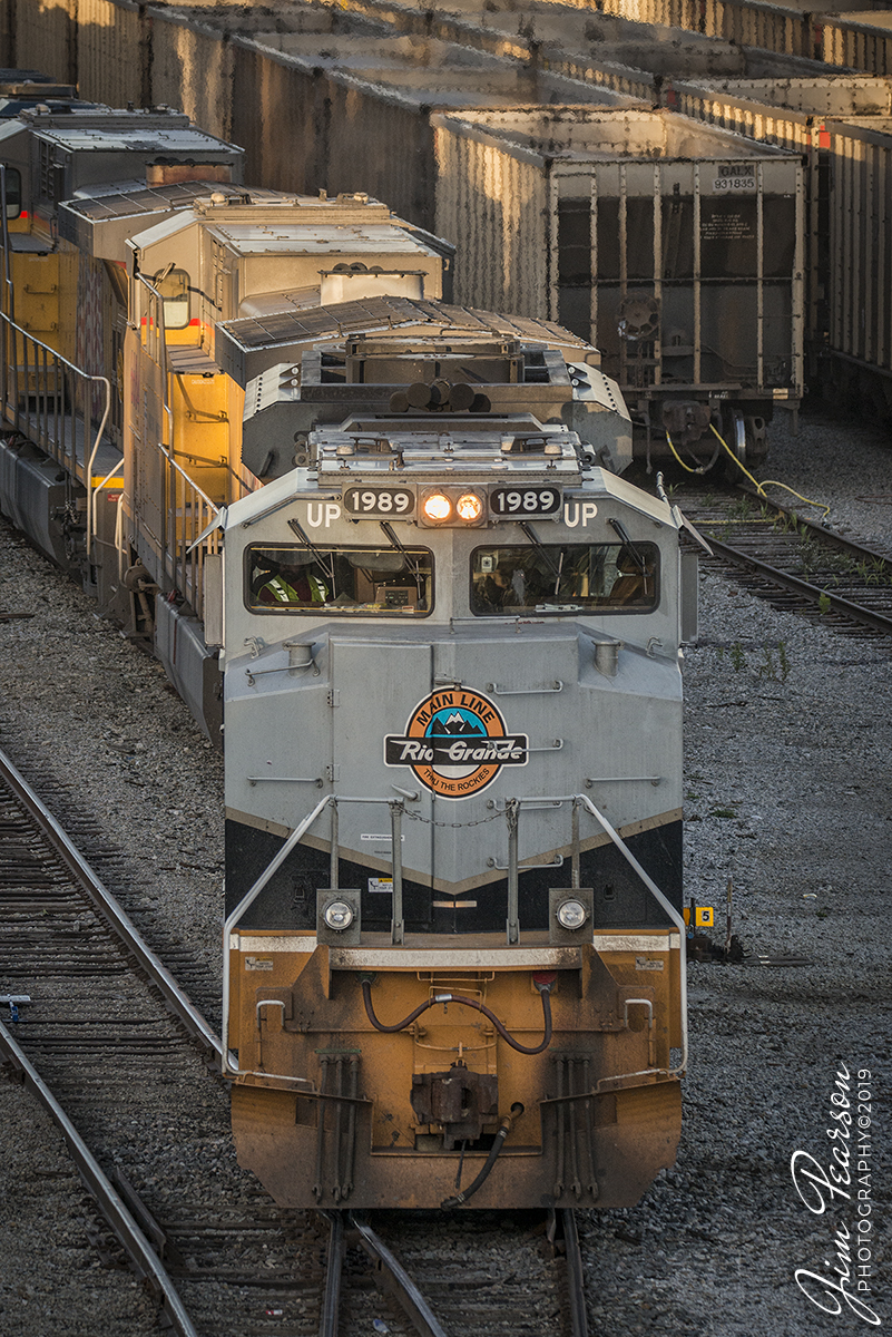 October 14, 2019 - Union Pacific 2089, Rio Grand Heritage Unit, backs into a track at CSX's Howell Yard to drop off a CSX unit, in Evansville, Indiana. It leading southbound loaded coke train CSX W221-13 on it's way through the CE&D and Henderson and other Subdivisions through Illinois, Indiana, and Tennessee on its way to Georgia. Not sure why it made its way through our area, but sure glad it did! Thanks to all the folks that gave heads up along the way!!

According to Wikipedia: Union Pacific 1989: Serial number 20056723-098, is painted in Denver and Rio Grande Western Railroad colors. It was delivered on 24 May 2006, unveiled on June 17, 2006, at a special UP employee event in Denver, Colorado.

It is one of six EMD SD70ACe locomotives that are painted in the liveries of railroads acquired by the Union Pacific. The company says the locomotives "pay homage to those railroads and the generations of men and women who helped to build a great nation and the foundation for our future."