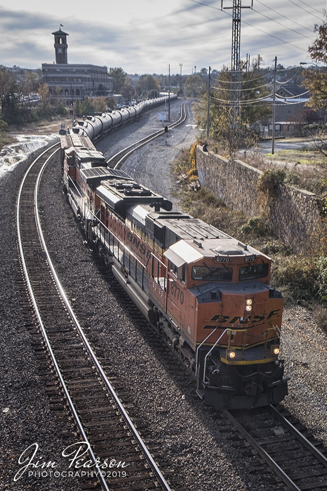 November 12, 2019 - BNSF 8770 snakes a tank train past Union Station in downtown Little Rock, Arkansas as it heads north on UP's Little Rock Subdivision.