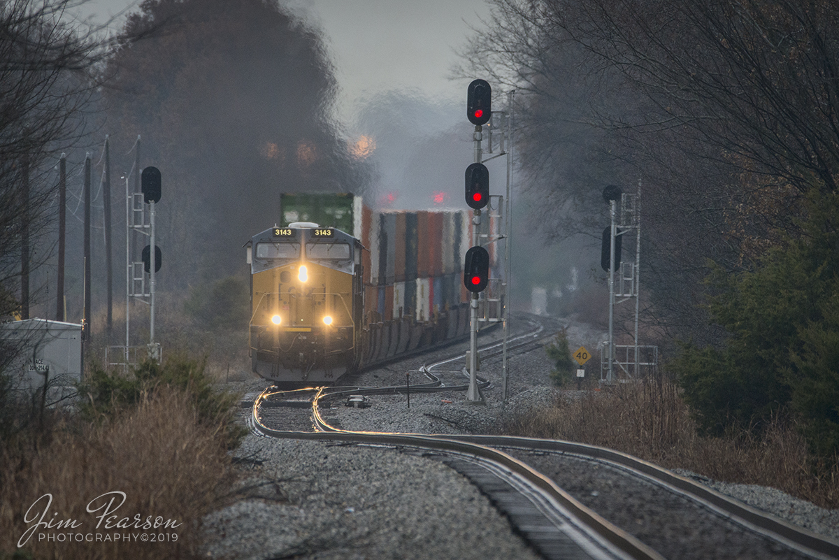 November 30, 2019 - Spent a good deal of the day chasing trains in the rail with fellow railfan photographer Cooper Smith today with his new camera! While we had spells of light rain, most of it was the opposite! I really enjoy getting trackside during bad weather as it gives the photos a much different look and afterall, railroads operate in all kinds of weather! 

Here we see CSX Intermodal Q025-30 as it heads past Moore at the south end of Guthrie, Ky as it makes it's way south on the Henderson Subdivision.

Hardest thing about railfanning in bad weather is getting out the door! I keep a pair of golf umbrellas in my SUV all the time just for this type of weather! Lens hoods are also a good thing to have along with a large microfiber cloth for drying the mist from your equipment in the event you get some!