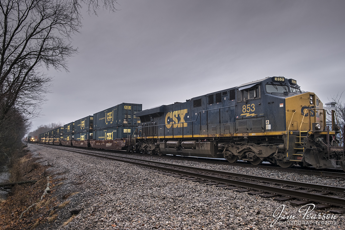 November 30, 2019 - CSX Q025 heads south as it prepares to meet the DPU on its counterpart, Q026 waiting in the siding to continue its trip north, on the Henderson Subdivision at Guthrie, Kentucky on a wet and rainy afternoon.