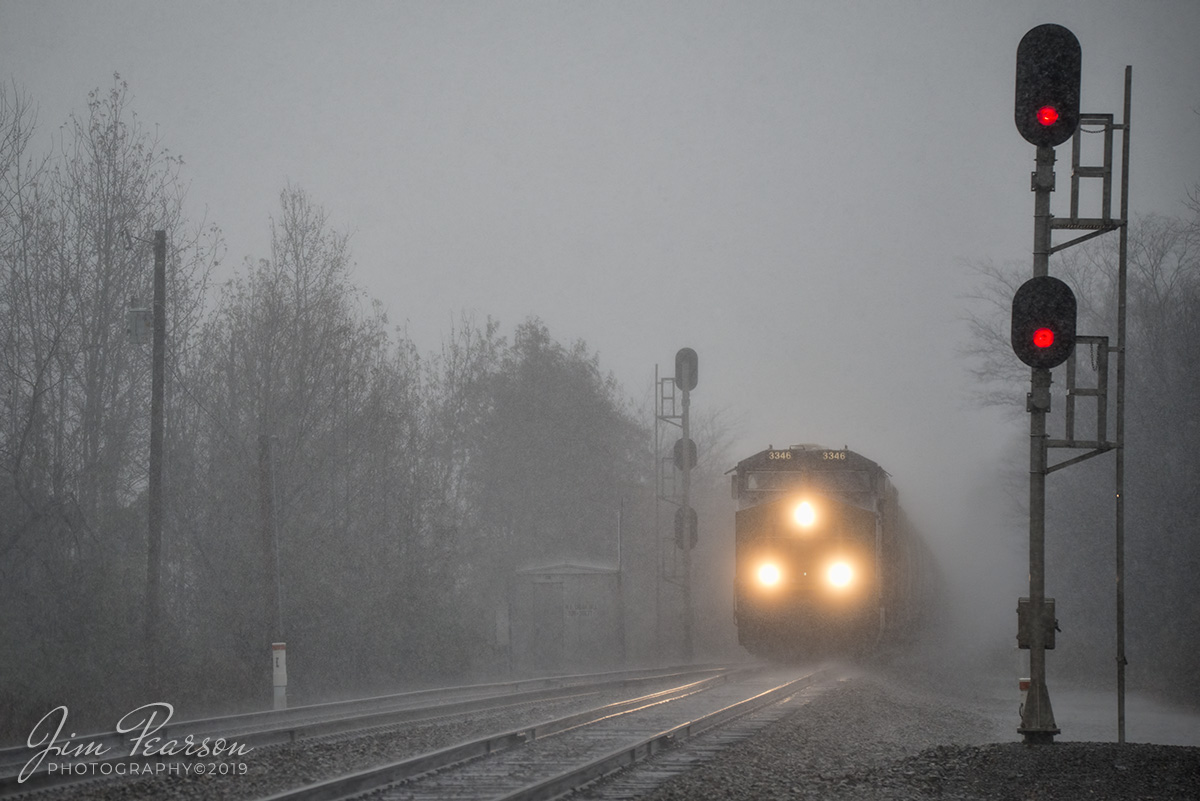 November 30, 2019 - Another stormy weather day with buckets of rain as CSX Q513 approaches the north end signals at Cedar Hill, Tennessee as it makes its way south on the Henderson Subdivision.