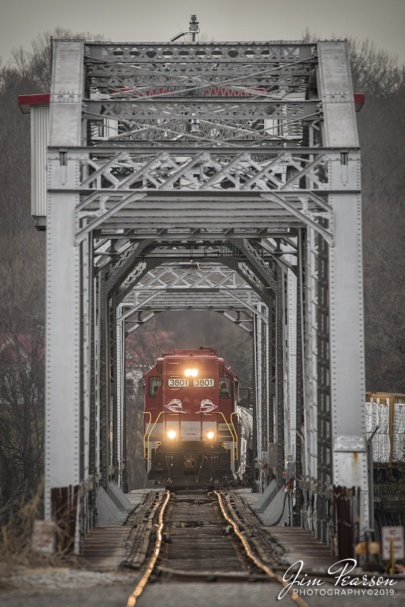 December 20, 2019 - RJ Corman's Cumberland City turn local prepares to cross the bridge over the Cumberland River as it makes it's return trip northbound on the Memphis Line at Clarksville, Tennessee with RJC 3801 and 3837 leading with their long noses forward elephant style for their return trip to Guthrie, Ky. 

It is a Swing through truss bridge and was constructed in 1891 by the Pencoyd Bridge & Construction Company for the Nashville, Chattanooga, and St. Louis Railway. It is still an operating bridge on the river and sees at most two trains a day, but most days only one. Trains head to Cumberland City, TN (SB) usually around 9:30am CST and return north on average about 2:30-3:30pm CST.