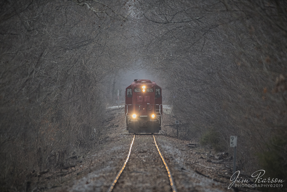 December 27, 2019 - This 600mm lens shot is of Fredonia Valley Railroad (Owned by Respondek Railroad)1605 (Ex-CP Unit) as it makes it's way through a tunnel of trees, approaching the road crossing at Red Bud Trail outside Princeton, Kentucky running at about 5 mph, after dropping off a string of empties to the Fredonia Quarry. It was returning to Paducah and Louisville Railways' yard at Princeton, Ky. 

This small shortline runs typically M-F with on average 1 train each way daily from what I'm told. The tracks were originally owned by Illinois Central, then West Kentucky Railway and in currently operated by Respondek Railroad who serves Martin Marietta. The Railroad runs from Princeton to Fredonia, Ky for about 12 miles. There's no access to the quarry for photos, but plenty of spots along the highway the follows the tracks most of the way.