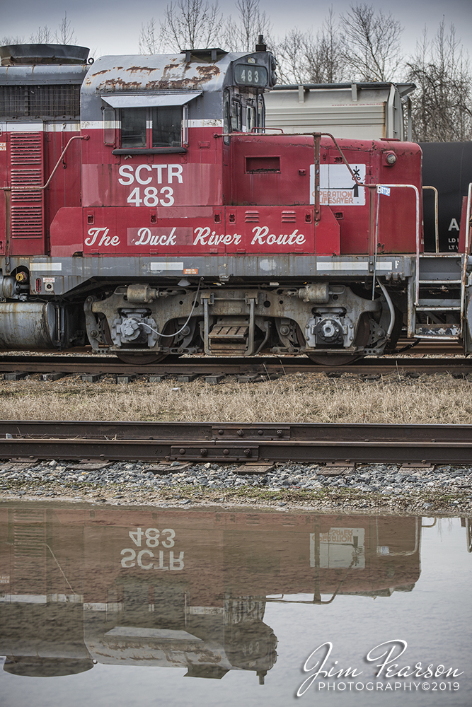 January 1, 2020 - South Central Tennessee Railroad "The Duck River Route" unit sits reflected in water next to the West Tennessee Railroad shops at Jackson, Tennessee on a quiet New Years Day.