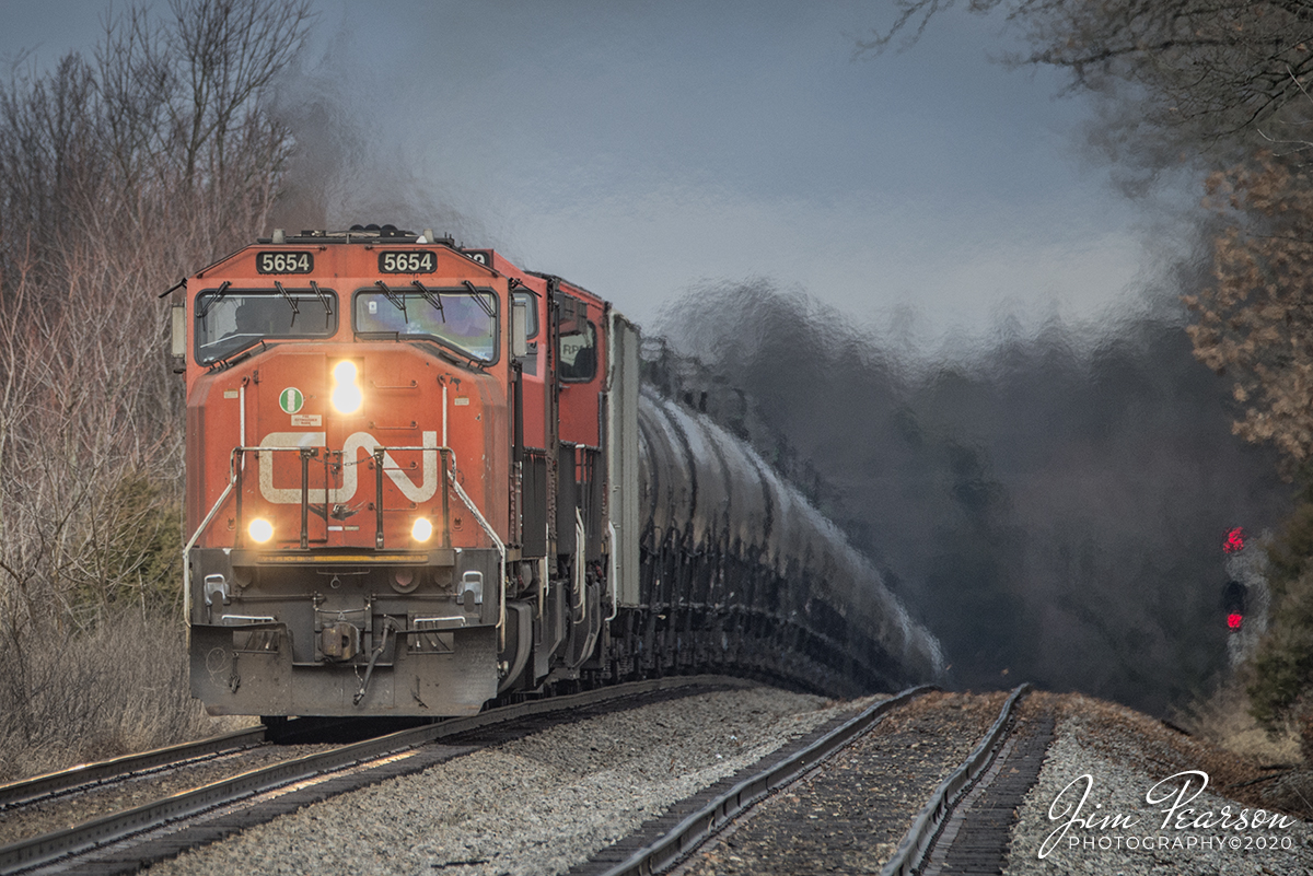 January 18, 2020 - Canadian National 5654 leads the way on CSX K445 as it pulls up the grade at north end of Crofton, Ky as it heads south on the Henderson Subdivision with a loaded ethanol train.