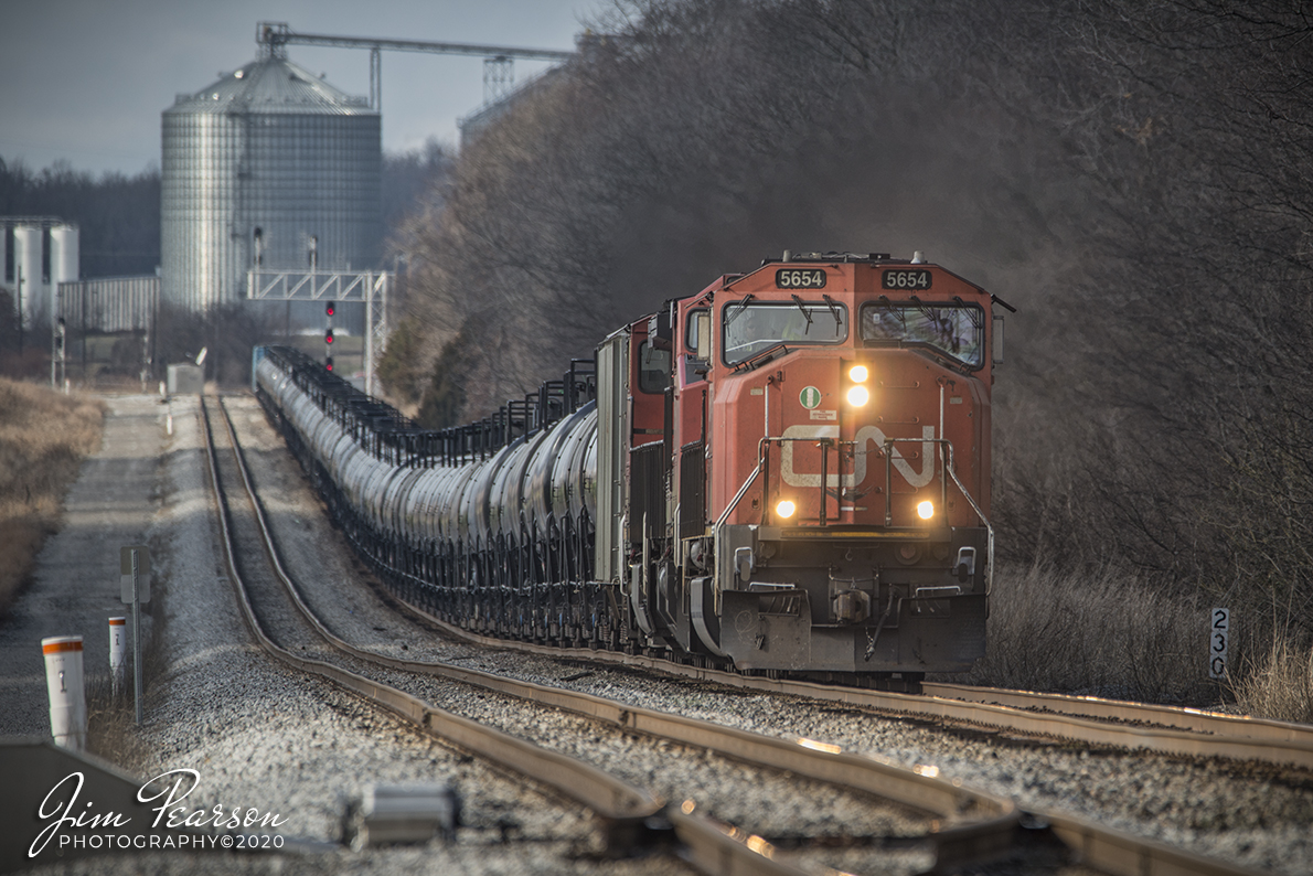 January 18, 2020 - Canadian National Ethanol Train CSX K445 heads up the grade at Pembroke, Ky with CN 5654 leading the way as it heads south on the Henderson Subdivision.