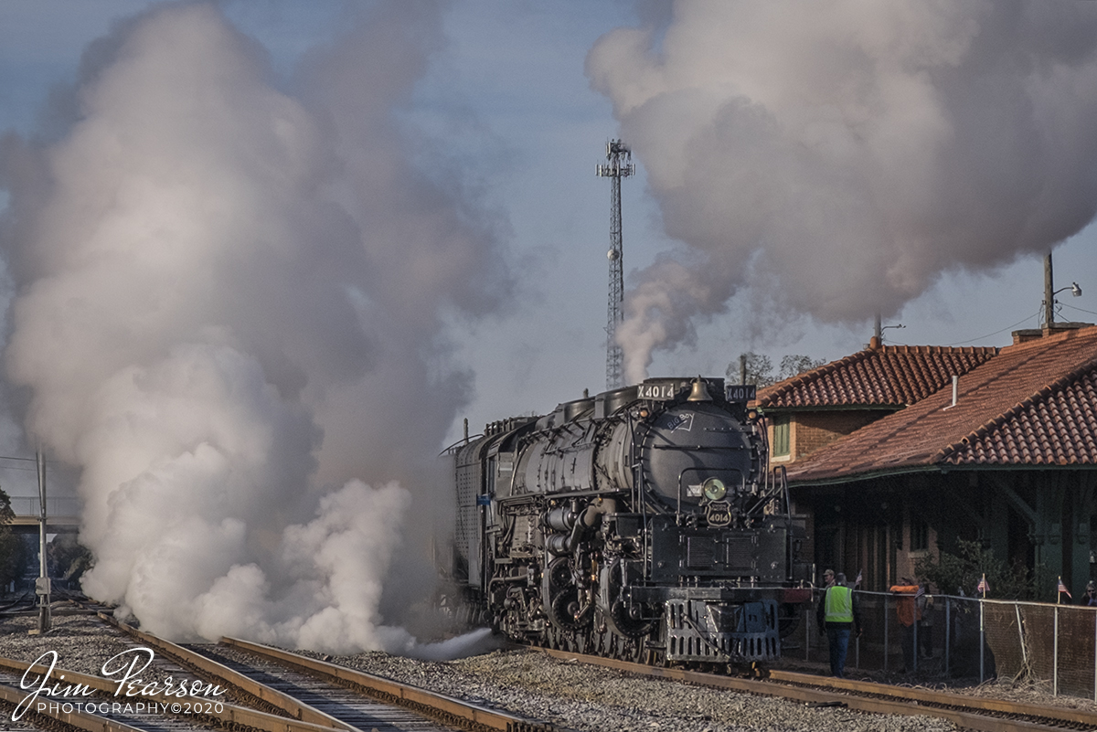 November 13, 2019 - Union Pacific 4014 "Big Boy" locomotive releases built up steam as it sits at the station in Prescott, Arkansas, waiting for time to depart north on UP's Little Rock Subdivision during UP's Great Race Across the Southwest steam tour.

According to Wikipedia: Union Pacific 4014 is a four-cylinder simple articulated 4-8-8-4 Big Boy-type steam locomotive owned and operated by the Union Pacific Railroad. Built in 1941 by the American Locomotive Company (ALCO) of Schenectady, New York, No. 4014 is the only operating Big Boy of the eight that remain in existence.

The locomotive operated in revenue service until 1959. It was donated to the Railway and Locomotive Historical Society in late 1961 and thereafter displayed in Fairplex in Pomona, California. In 2013, Union Pacific re-acquired the locomotive and launched a restoration project at their Steam Shop in Cheyenne, Wyoming.[citation needed] In 2019, No. 4014 was operated for the first time after it sat dormant for almost six decades. Part of Union Pacific's heritage fleet, it now operates in excursion service, in addition to hauling revenue freight during ferry moves.