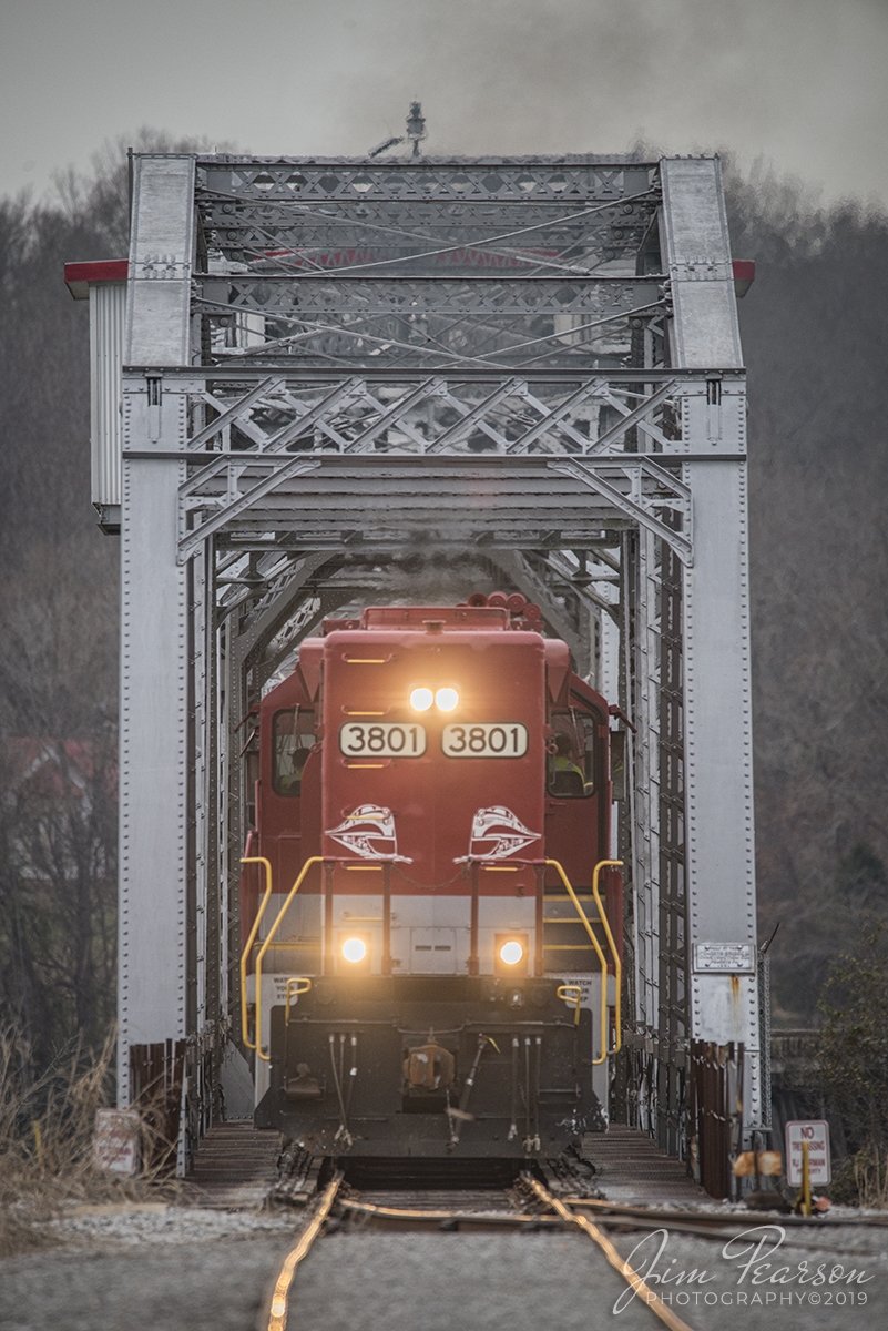 December 20, 2019 - RJ Corman's Cumberland City turn local exits the bridge over the Cumberland River as it makes it's return trip northbound on the Memphis Line at Clarksville, Tennessee with RJC 3801 and 3837 leading with their long noses forward elephant style for their return trip to Guthrie, KY. 

It is a Swing through truss bridge and was constructed in 1891 by the Pencoyd Bridge & Construction Company for the Nashville, Chattanooga, and St. Louis Railway. It is still an operating bridge on the river and sees at most two trains a day, but most days only one. Trains head to Cumberland City, TN (SB) usually around 9:30am CST and return north on average about 2:30-3:30pm CST.