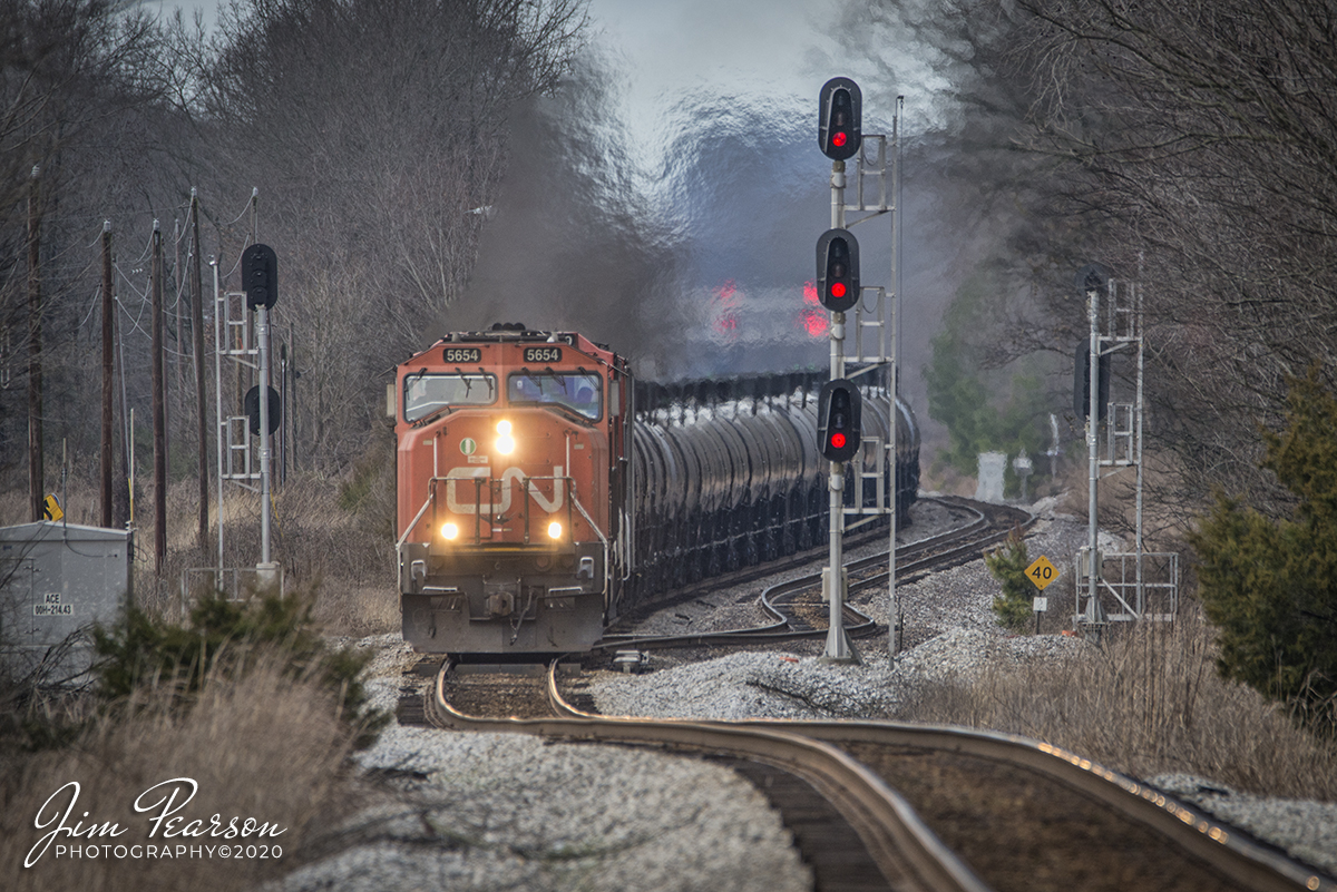 January 18, 2020 - Canadian National 5654 leads the way on CSX K445 as it prepares to pull upgrade at Ace, at Guthrie, Kentucky, as it heads south on the Henderson Subdivision with a loaded ethanol train.