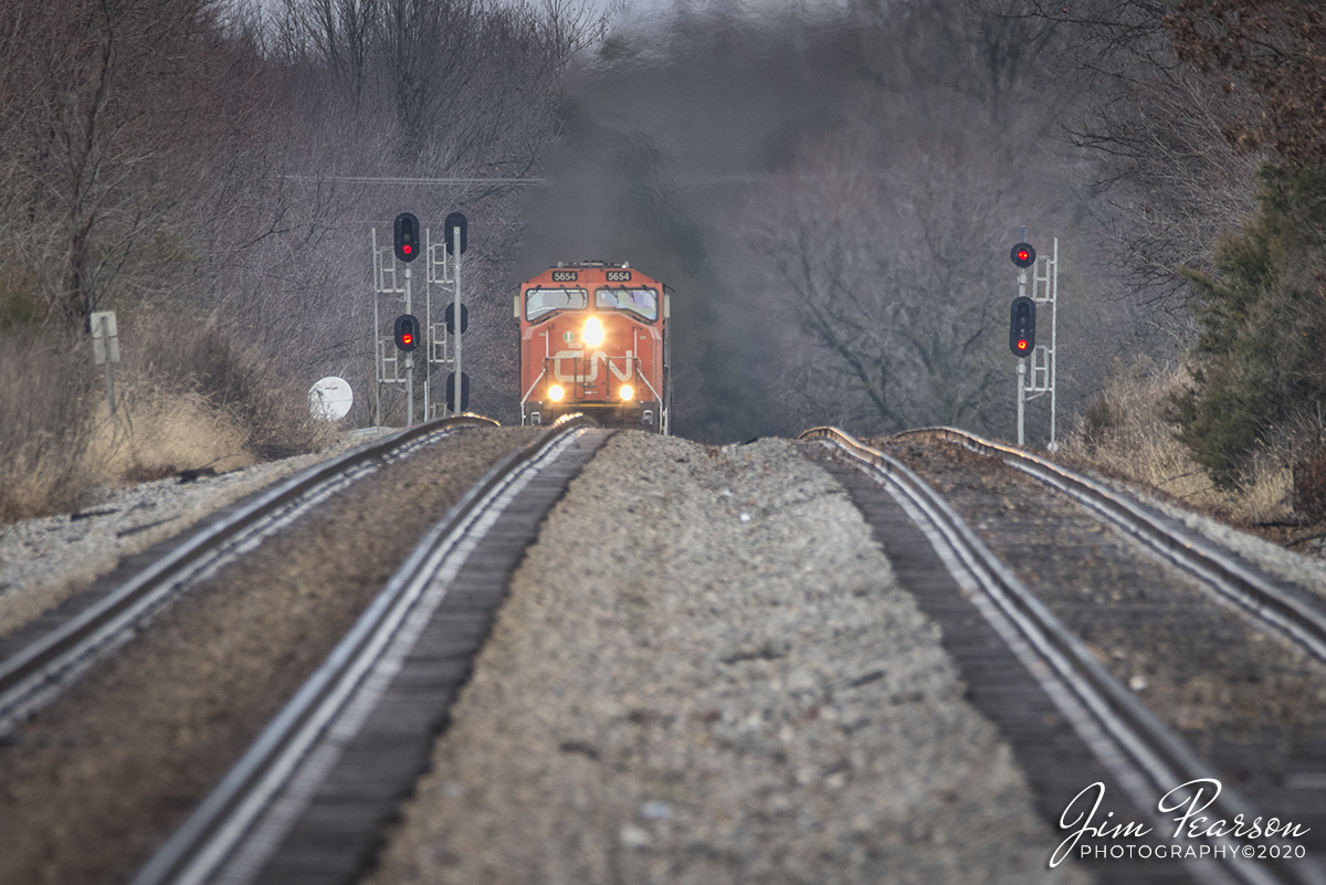 January 18, 2020 - At 1/2 mile away and a spotter watching my back the grade crossing, I caught this shot of Canadian National 5654 as it leads the way on CSX K445 nosing it's way over the crest of the hill at the north end of Crofton, Ky, with my 600mm, as it heads south on the Henderson Subdivision with a heavy ethanol train.