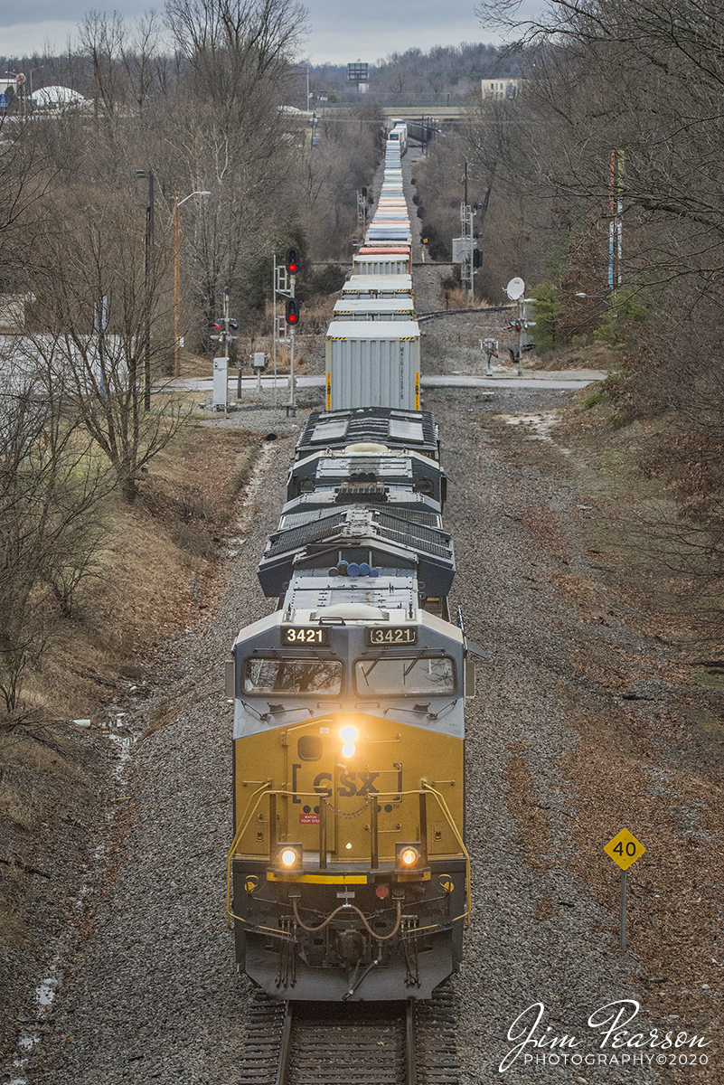 January 18, 2020 - CSXT 3421 leads CSX Q025 as it heads south on the Henderson Subdivision after crossing the diamond at Trident in Madisonville, Ky with its loaded stack train approaching the north Main overpass.