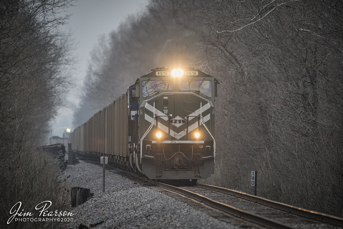 January 29, 2020 - Paducah and Louisville Railway (PAL) 4516 & 2012 head up a northbound loaded Louisville Gas & Electric Coal train as it pulls out of the siding at Pond River, at Madisonville, Ky. Behind it sits a PAL Local waits patiently for it to clear.