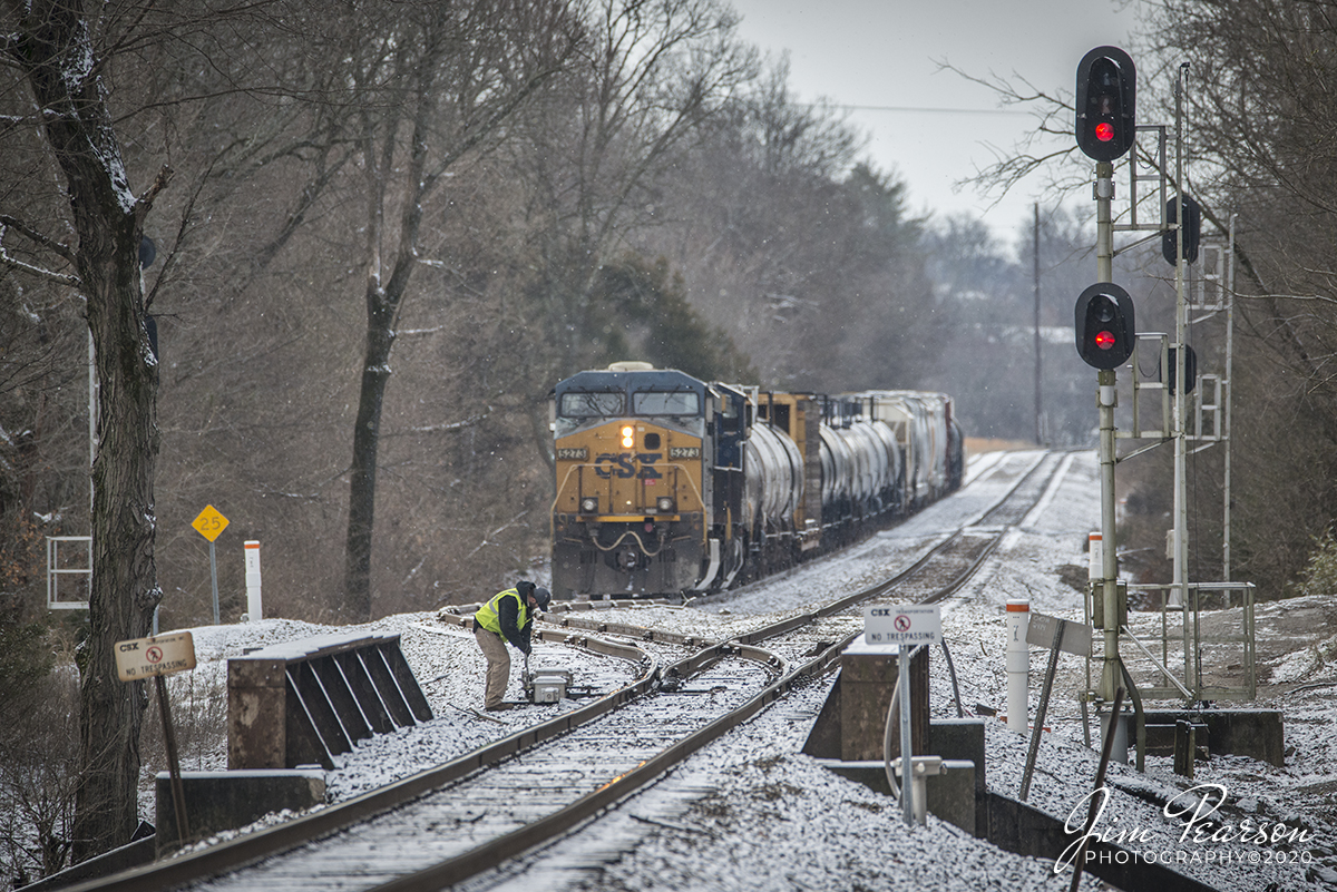 February 7, 2020 - The conductor on local CSX J732 manually throws the switch at the north end of Latham siding at Hopkinsville, Ky as they attempt to get it to lockup after a light overnight snowfall so they can continue their trip north to Madisonville, Ky on the Henderson Subdivision.