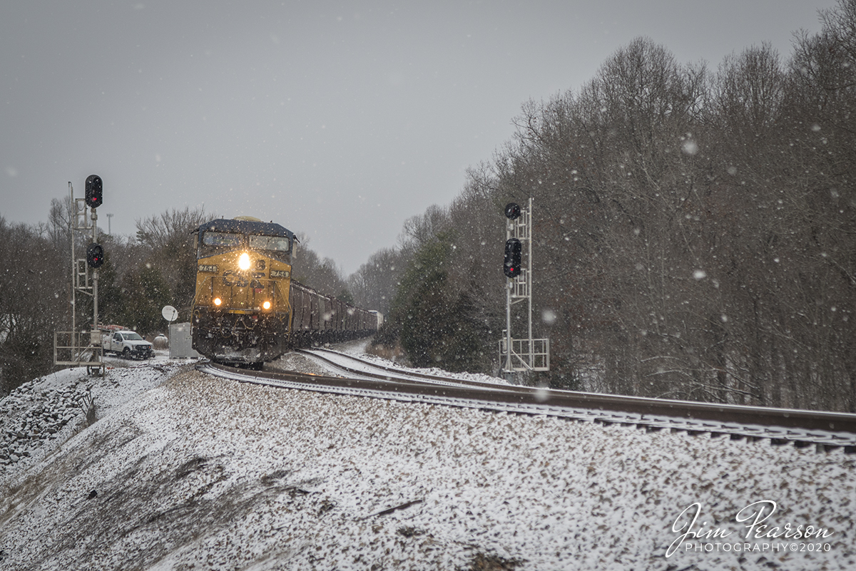 February 7, 2020 - CSXT 754 pulls CSX Q503-06 pulls past the signals at the north end of Kelly siding as it works its way south through the early morning blowing snow on the Henderson Subdivision at Kelly, Kentucky.