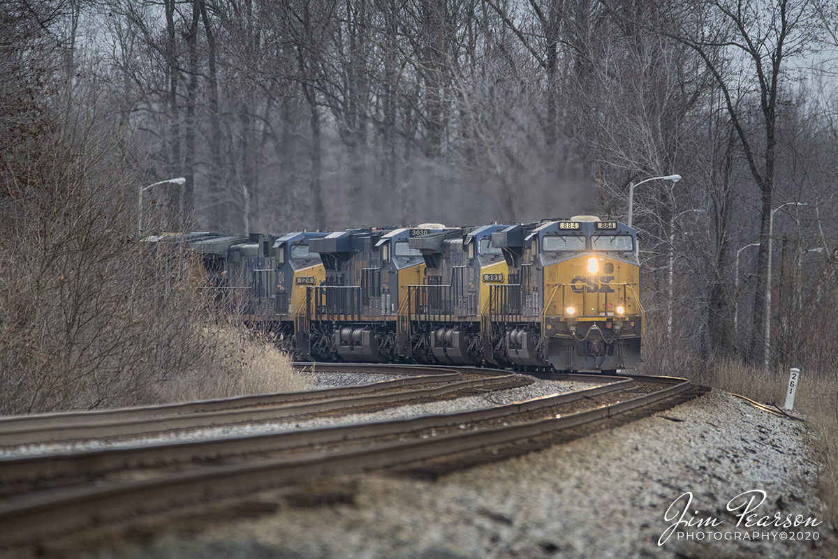 February 17, 2020 - CSXT 884 leads, CSXT 391 (Spirit of Dante), 3030, 124, 829 and one other unidentified unit, heads-up CSX Q025-17 (Bedford Park, IL - Jacksonville, FL) as it heads through the curve leading to the Romney CP at Nortonville, Ky as it heads south on the Henderson Subdivision with its hot intermodal train.