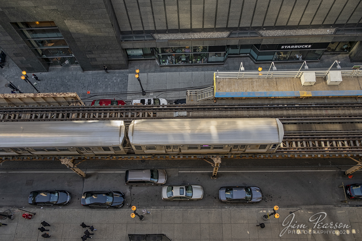 February 20, 2020 - A slightly different viewpoint of a Chicago Transit Authority Pink Line arriving at the State/Lake Street "L" station as it makes its way around the downtown loop in Chicago, Illinois.