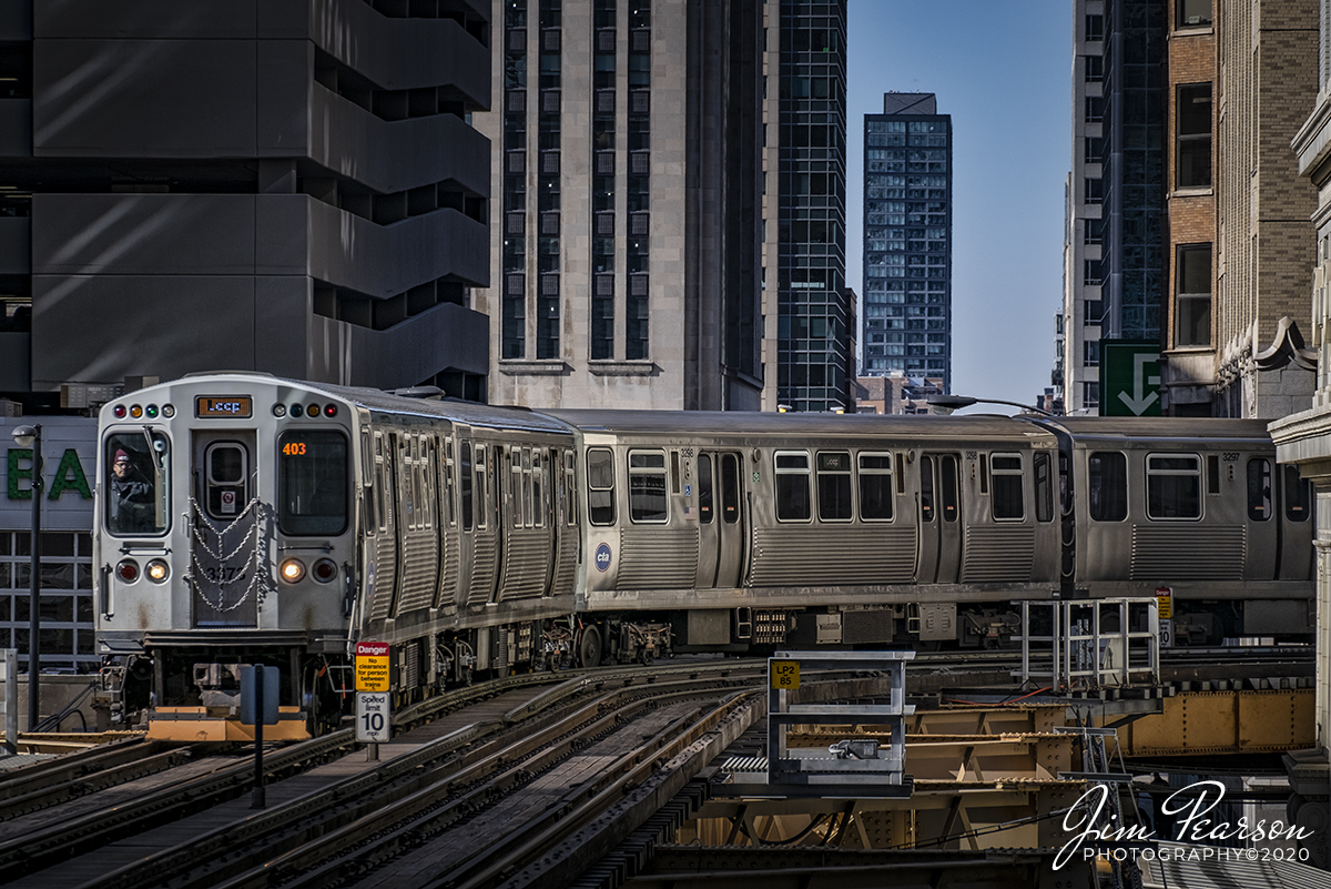 February 20, 2020 - The engineer on Chicago Transit Authority (CTA) Loop Train 403 keeps a watchful eye on the track ahead as he navigates his train around a curve as he makes his seemingly never ending loop through the canyons of downtown Chicago, Illinois.