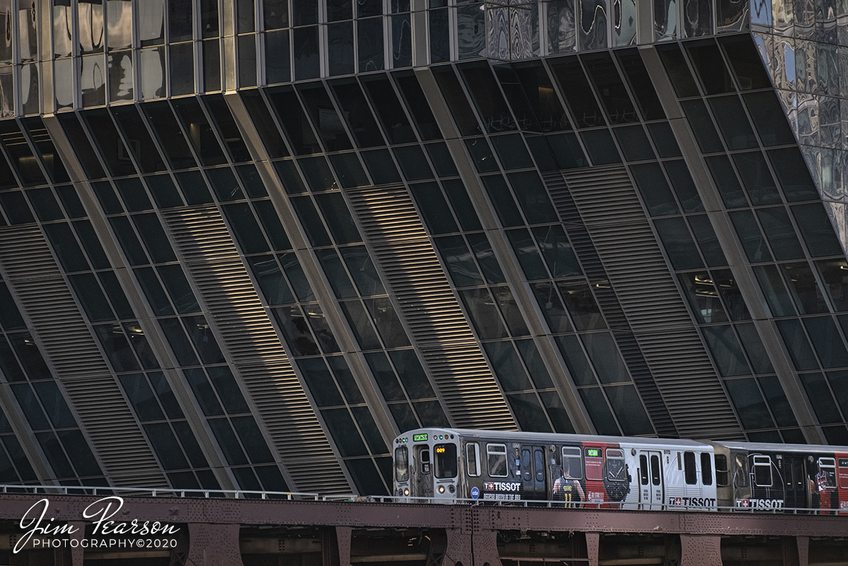 February 20, 2020 - A Chicago Transit Authority Green Line train heads toward the loop in downtown Chicago, Illinois as the late afternoon light plays on the building behind it.