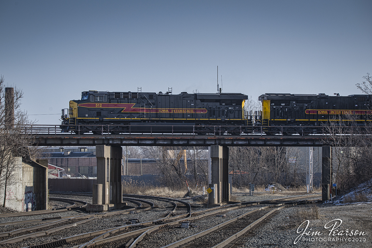 February 22, 2020 - Iowa Interstate units 512 &  517 cross over the CSX Elsdon Subdivision as it runs engine light along the Metra Joliet Sub District at Blue Island, Illinois.