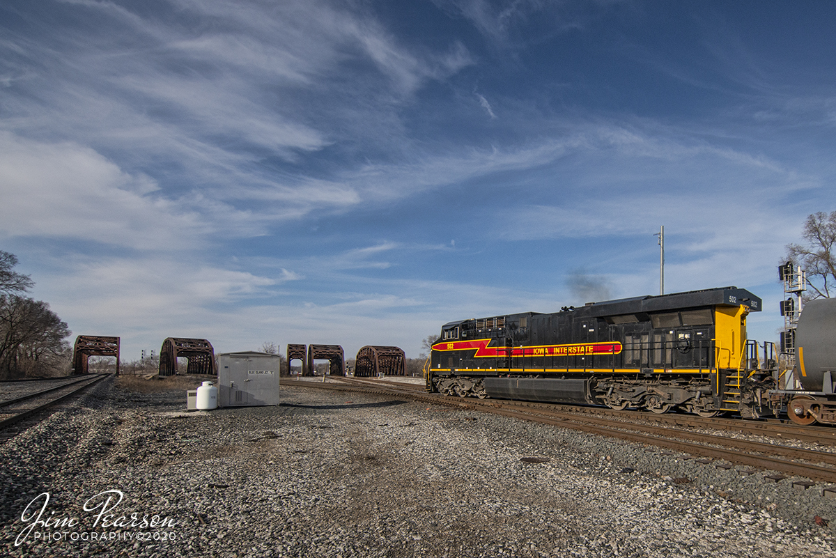 February 22, 2020 - The afternoon Iowa Interstate local, with unit 502, backs through Blue Island Junction at Blue Island, Illinois, as they head to CSX Barr Yard to do interchange work.

According to Wikipedia: The railroad was formed on November 2, 1984, using former Chicago, Rock Island and Pacific Railroad tracks between Chicago, Illinois, and Omaha, Nebraska. It was in partnership with real estate firm Heartland Rail Corporation that the IAIS was able to operate. Heartland purchased the right-of-way and infrastructure for $31 million (of which, $15 million was a loan from the Iowa Railway Finance Authority), and then leased it to IAIS for operations.

The IAIS and the railroad infrastructure were purchased from Heartland by Railroad Development Company of Pittsburgh, PA in 2003.

In recognition of the railroad's Rock Island Railroad heritage, the IAIS logo uses a shape similar to the original railroad's logo and has also painted two of its General Electric ES44AC locomotives (513 and 516) in Rock Island inspired paint schemes.

When the IAIS took control of the track, the former Rock Island signal system was already damaged beyond repair due to sitting dormant for several years. Operations on the railroad are primarily controlled by track warrants rather than signals as a result.

Trains are dispatched from the company's HQ in Cedar Rapids, Iowa, where a new dispatching office was completed in 2016. IAIS uses Wabtec's Train Management and Dispatching System (TMDS), the same dispatching software used by several Class I railroads, including the BNSF and KCS.