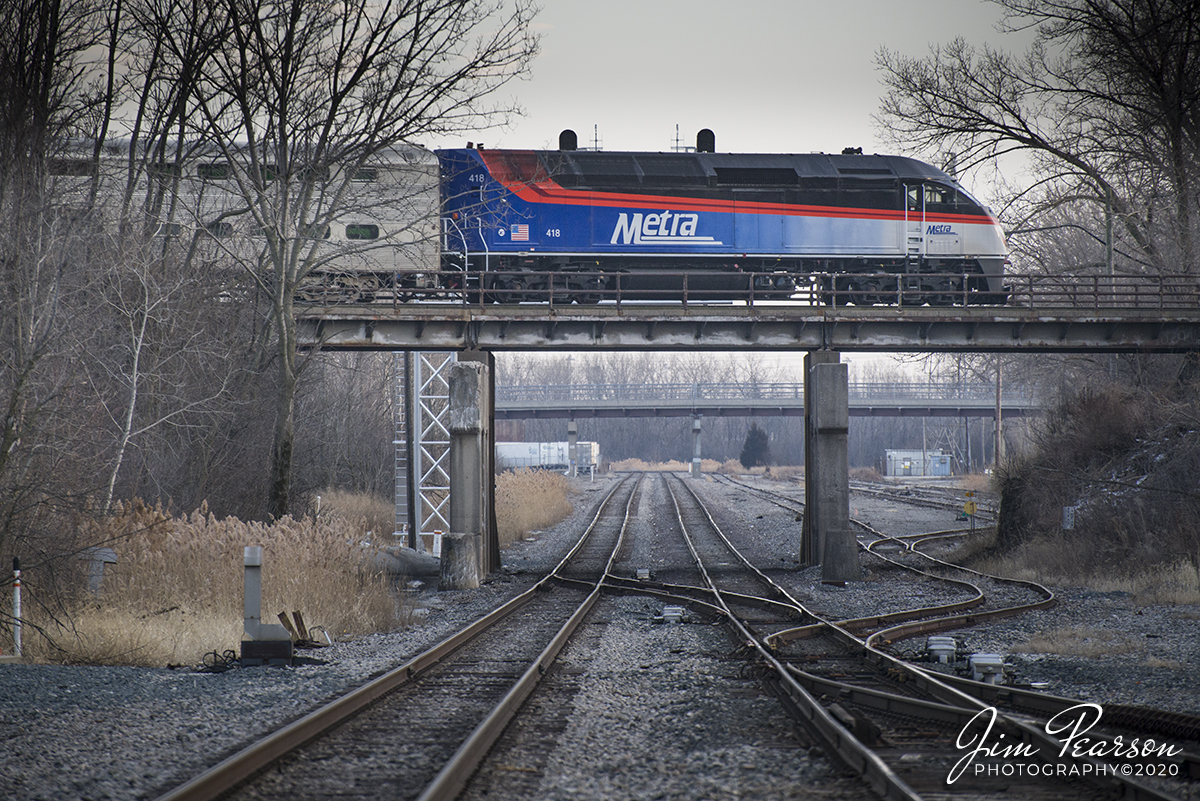 February 22, 2020 - Metra engine 418 crosses over the CSX Elsdon Subdivision as it heads along the Metra Joliet Sub District at Blue Island, Illinois. I spent a good part of the morning and afternoon here at Blue Harbor today and ever caught a single train on the Elsdon Subdivision, but some days are like that!
