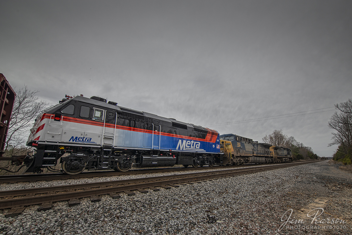 March 9, 2020 - Newly painted and rebuilt Metra 198 brings up the rear on CSX Q648-08 as it passes through the south end of the siding at Slaughters, Kentucky as it heads north on the Henderson Subdivision on the way to Chicago, Illinois with CSXT 380 and 120 leading the way.