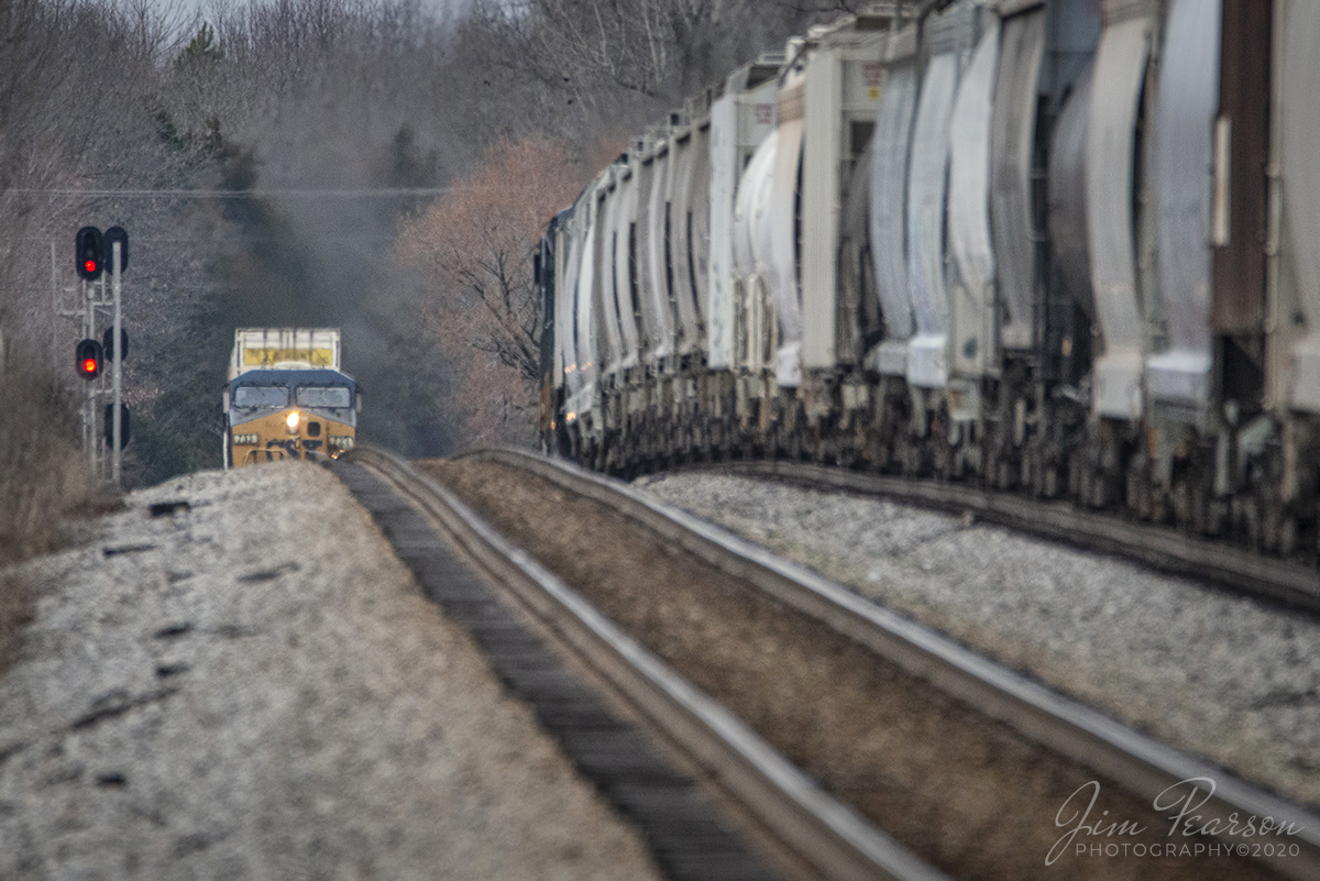 March 10, 2020 - Southbound CSX Intermodal Q029-10 sticks its nose up over the rise as it meets northbound Q502-10 sitting in the siding on the Henderson Subdivision at Crofton, Kentucky.