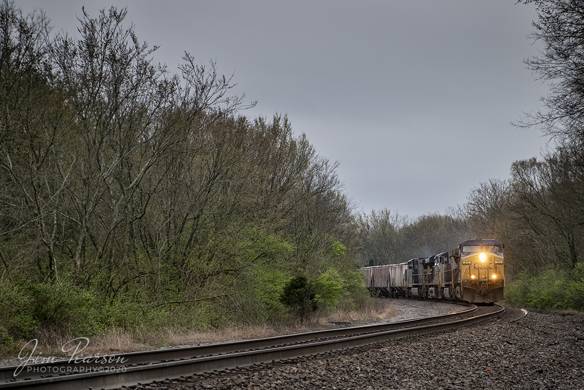 March 12, 2020 - CSXT 319 leads a mixed freight as it rounds the curve coming into CP Brentwood on the N&NA North Subdivision as it heads north at Brentwood, Tennessee.