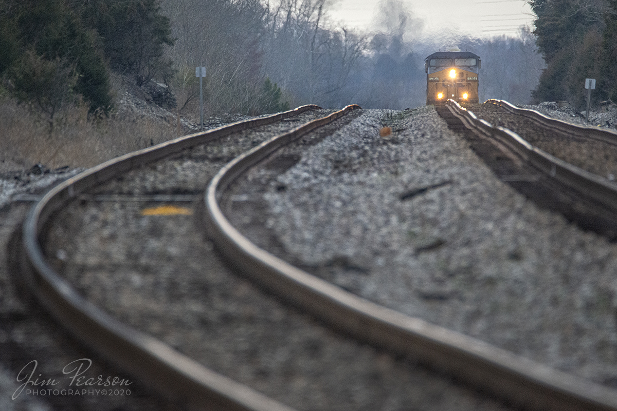 March 12, 2020 - I could hear the rumble of CSXT 6354 as struggled as the lone operating engine on its over 6,000 ft manifest train as it made its way up the grade on the main at the middle of the siding at Kelly, Kentucky as it headed north on the Henderson Subdivision. 

Dispatch had been talking to him about his power troubles and I decided to head to the to the crossing with my 150-600mm Sigma Lens and wait for him as I knew the was going to struggle over the rise of the grade there.

I really enjoy the views and looks I can get at 600mm with this lens! I even like the way it makes the tracks look, which sometimes, like the track at 600mm, can get some folks bent out of shape! LOL