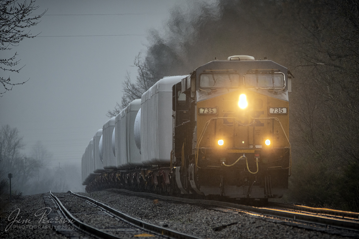 March 18, 2020 - One of the safe things we can do during this current Coronavirus scare is do some railfanning by ourselves! I had a semi-annual Dr. Checkup today and after the appointment I spent some time railfanning in the rain! Yes, I railfan in all kinds of weather since railroads run in all kinds of weather! All you need is a good golf umbrella along with some timing!

Here I caught CSX W990, a 1,800 ft train loaded with wind turbine generators as it crested the hill at middle Kelly as it made its way north on the Henderson Subdivision at kelly, Ky.

The hardest thing about shooting in bad weather is getting out the door! I keep a good golf umbrella and a large microfiber cloth in my car for just such days!