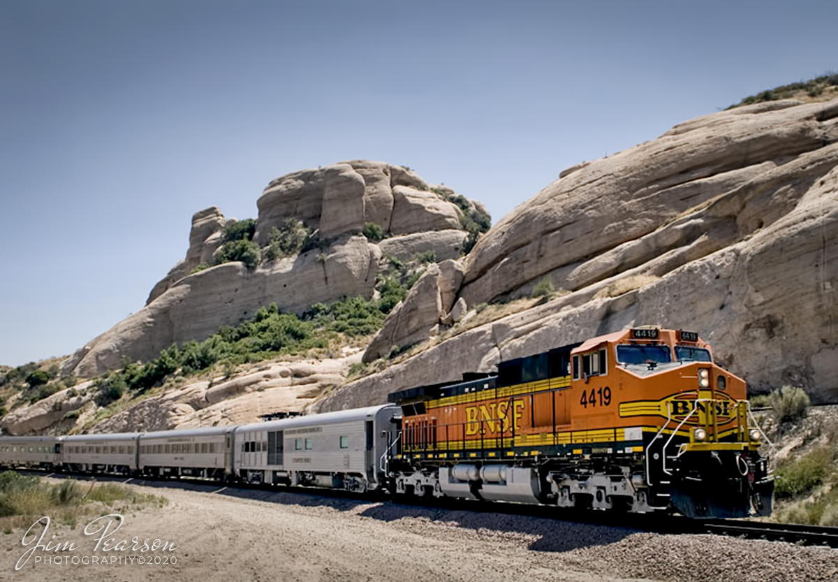 March 30, 2020 - I stumbled across this image and several others on my old Mac G4 Laptop that I shot back in 2006 with my old Nikon D200 and thought I'd share a few of them. This one is from June 6, 2006 of BNSF 4419 leading a business train east bound through Sullivan's Curve just west of Cajon Junction in southern California, headed to Barstow, CA.

From the Web we learn that “Sullivan's Curve is where the Union Pacific Palmdale Cutoff, and the BNSF mains 1 and 2 curve in a large horseshoe curve directly next to some large, rather impressive, rock formations. Promotional photos taken at this curve for the Santa Fe in the 1930’s through the 1950’s by photographer Herb Sullivan were fantastic, and made famous by their composition. The curve that he used so frequently was named in his honor, and rightfully so.”