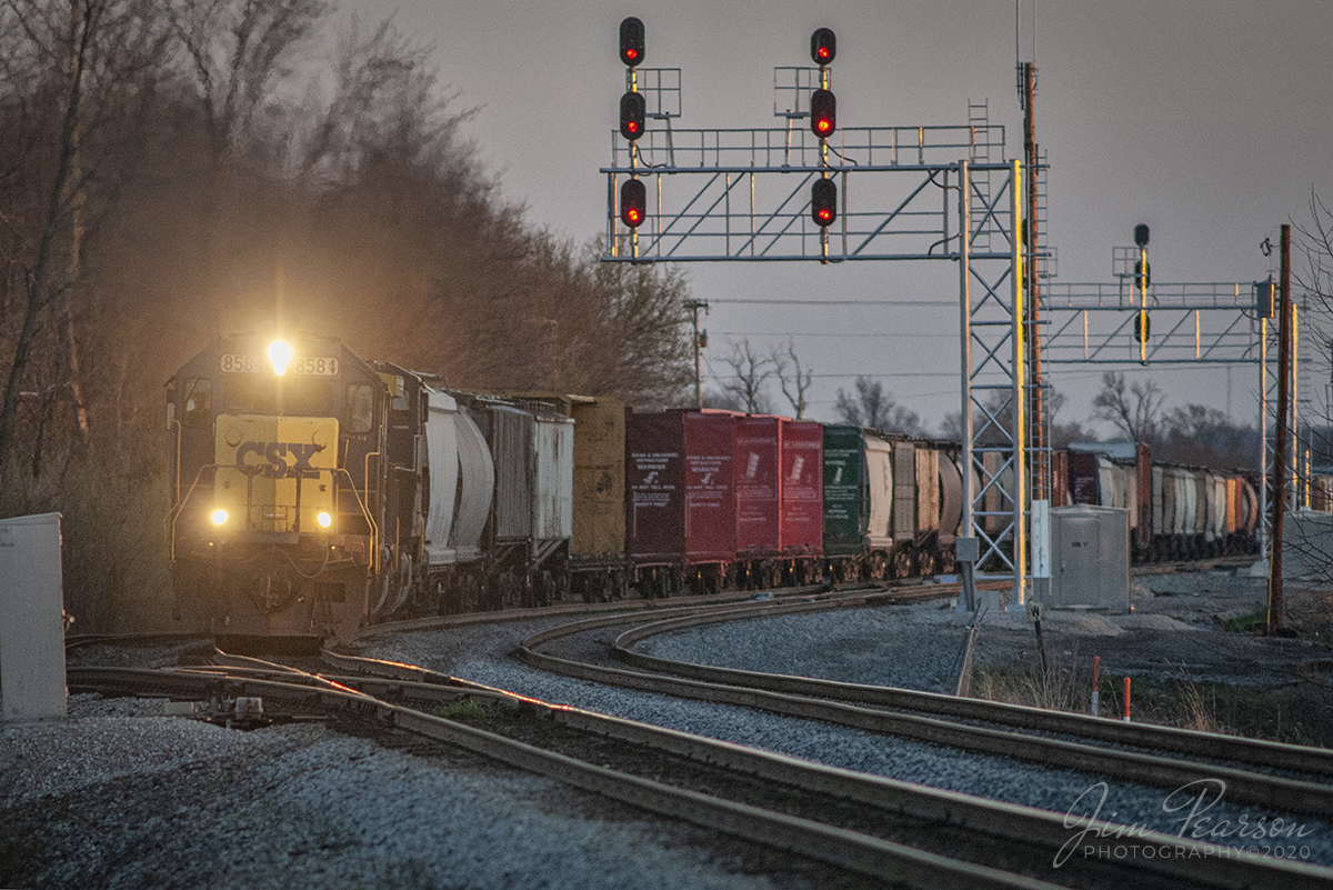 April 4, 2006 - Blast From The Past - CSXT 8584 leads a mixed freight past the signals approaching the southern crossover, where CSX and Norfolk Southern crossover on the CSX CE&D Subdivision, as it heads north through Princeton, Indiana.