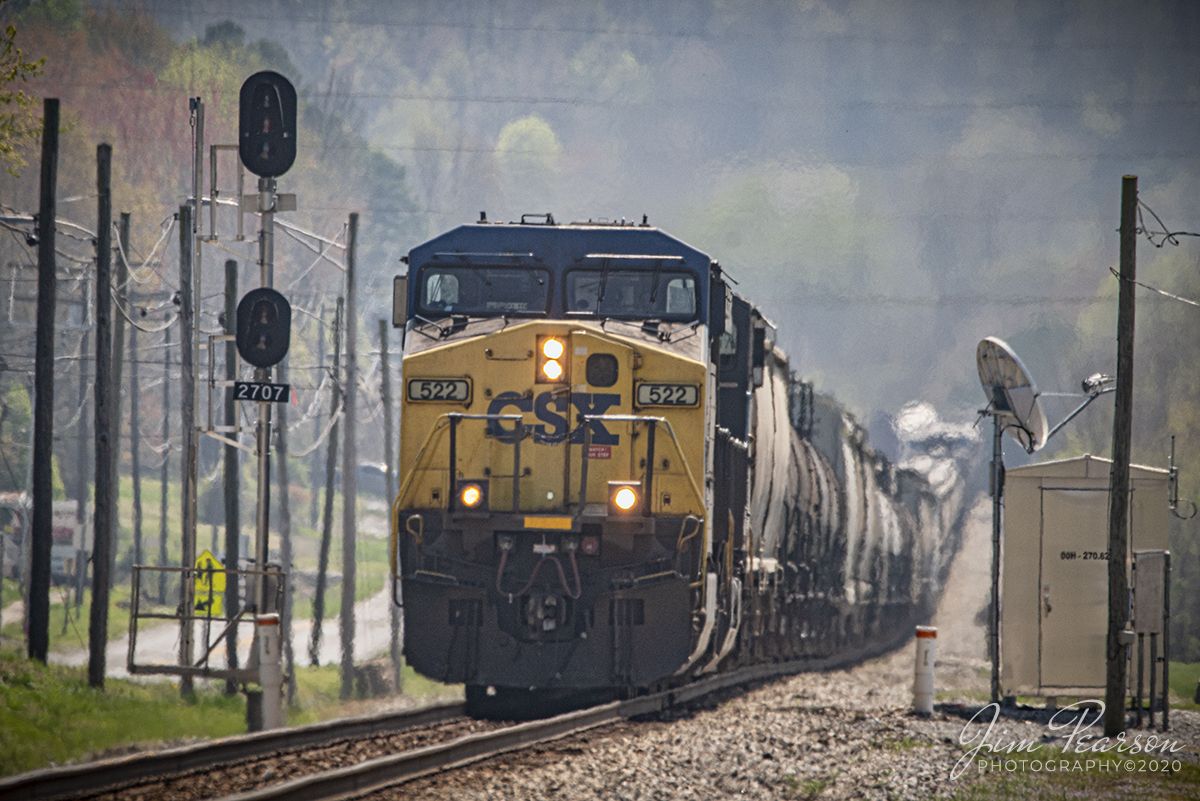 April 5, 2020 - CSXT 522 pulls uphill as it leads CSX Q502 north at Earlington, Kentucky on the Henderson Subdivision on Palm Sunday, on it's daily run between Nashville, TN and  Chicago, IL.