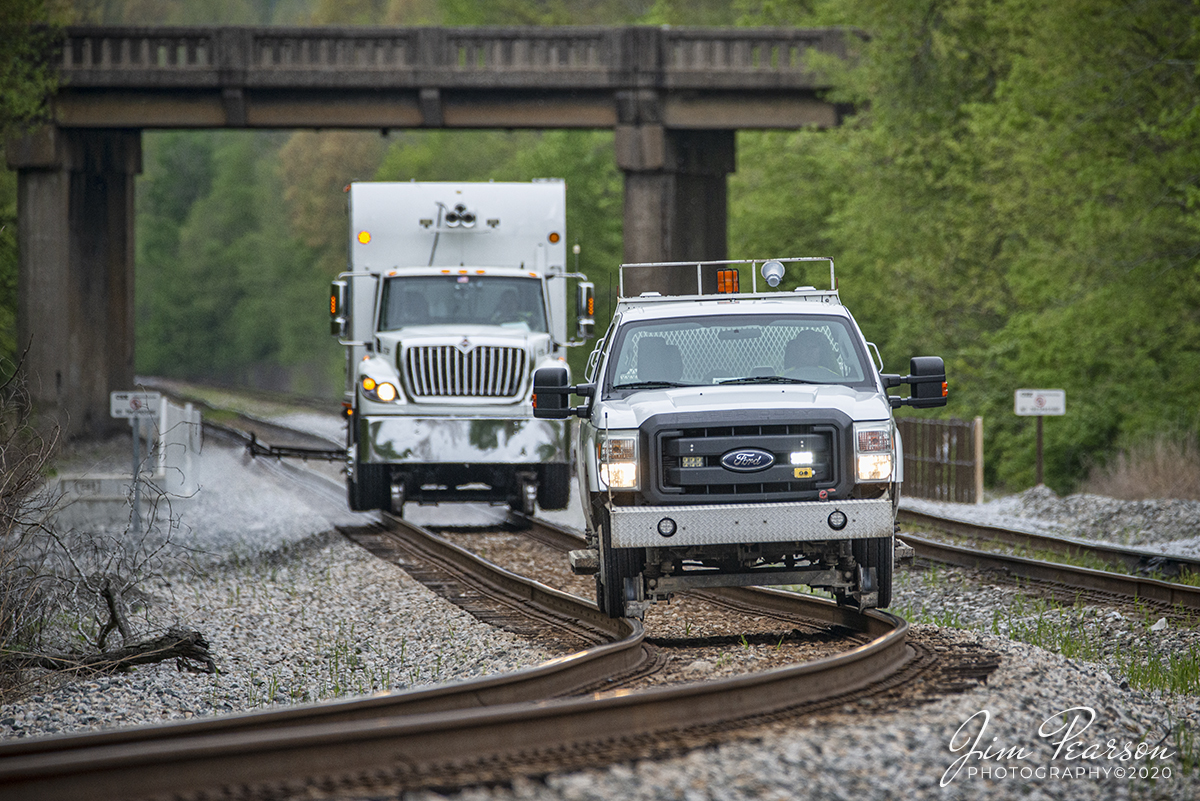 April 14, 2020 - A CSX High Railer leads a weed sprayer truck just past the highway 62 overpass on track 1, as it sprays the right-of-way at Nortonville, Ky, as the pair make their way south on the Henderson Subdivision, while performing their springtime work.