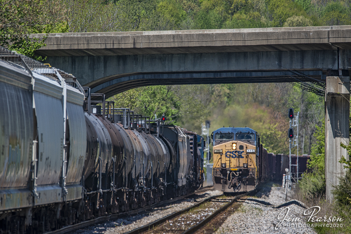April 20, 2020 - CSX empty ballast train W086 takes the siding at Oak Hill as it passes a northbound CSX 502-20 on the main as the ballast train makes heads under the I-69 overpass on its way south on the Henderson Subdivision.