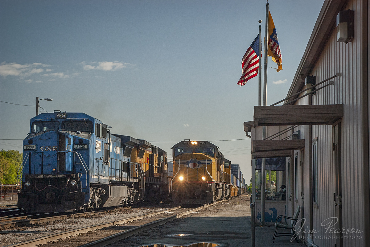 May 1, 2005 - Blast From The Past - Union Pacific 3961 pulls to a stop at the UP yard office in Salem, Illinois, with its intermodal train, on the Salem Subdivision as a loaded manifest with ex-Conrail 8339 leading waits for it to pass.