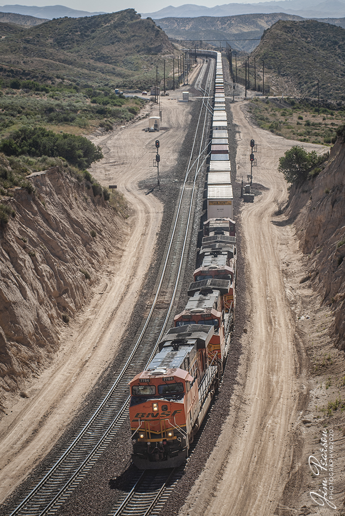 June 21, 2006 - A Blast from the Past - BNSF 7784 leads three other units on a west bound intermodal at Cajon Summit at Hesperia, California as they begin their descent through the Cajon Pass toward Los Angeles on the BNSF Cajon Subdivision.