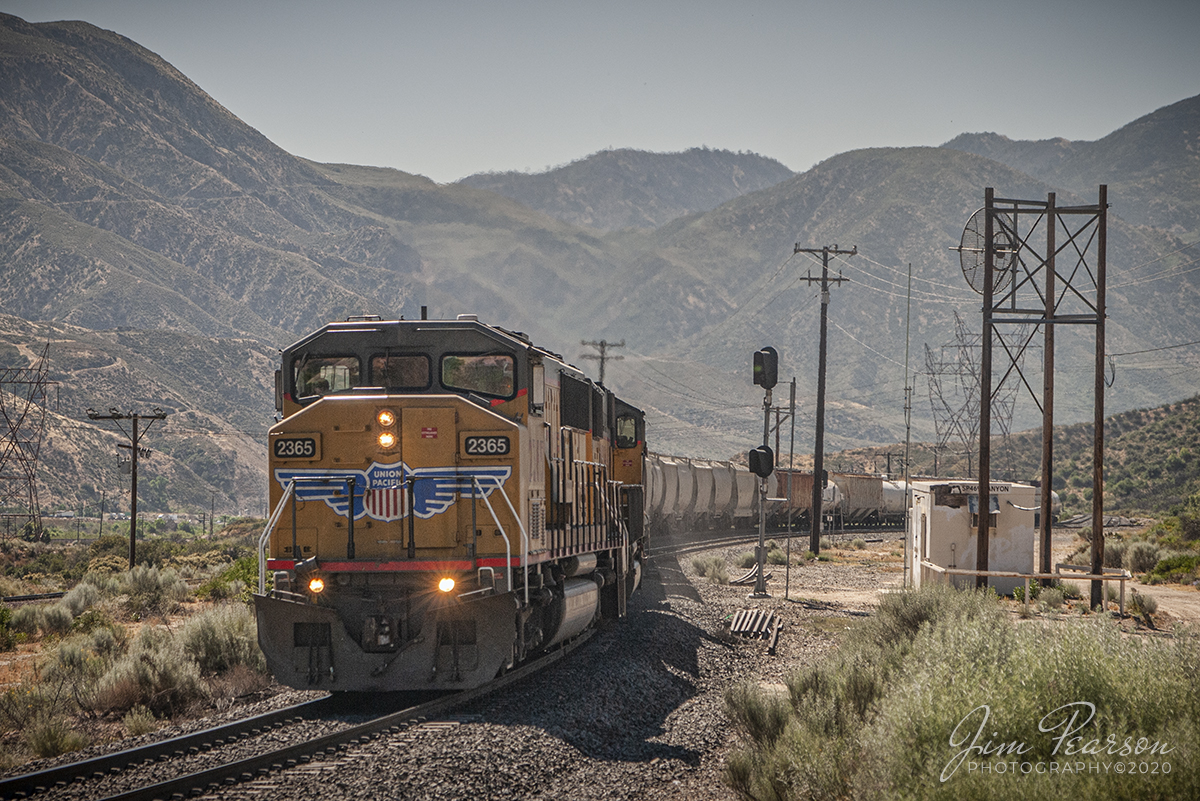 June 21, 2006 - Blast From The Past - It's 9:45 in the morning as Union Pacific 2365 struggles past CP Canyon as it heads east up the Cajon Pass in southern California with a loaded manifest.The pass is one of the busiest rail areas in southern California.