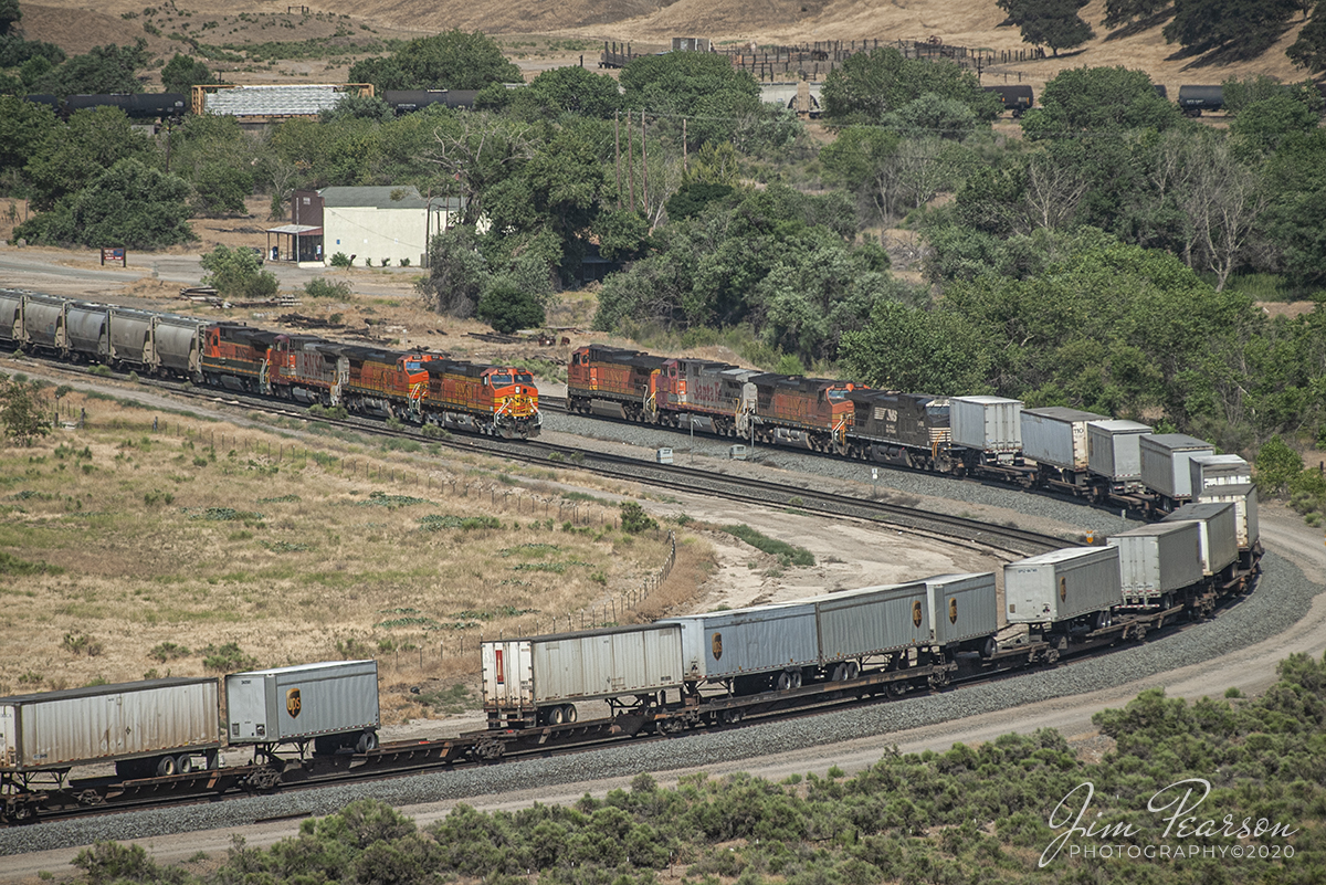 June 23, 2006 - Blast From The Past - It was a hot, dry day as a Piggyback with BNSF 5232 leading headed east, meeting a Mixed freight headed up by BNSF 4438 waiting to head west toward Bakersfield, in horseshoe curve in the valley at Caliente, California as they made their way through the Tehachapi Mountains on the UP Mojave Subdivision.

Thinking of visiting this area? Check out this page on the web!
http://www.trainweb.org/brettrw/maps/caliente.html