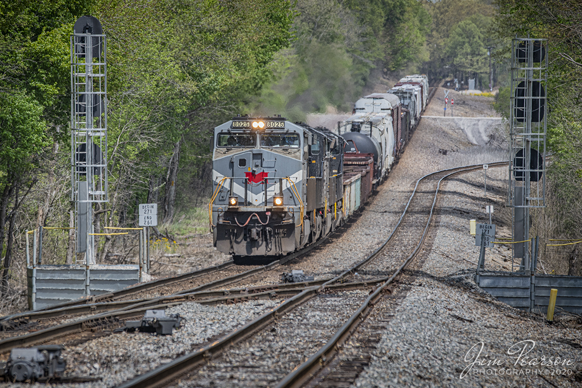 April 29, 2020 - Norfolk Southern 8025, Monongahela Heritage Unit, leads NS 168 (Louisville, KY to St. Louis, MO) as passes through Hatfield Junction, east of Oakland City, Indiana, as it heads west on the NS Southern East-West District.

In 2012, Norfolk Southern celebrated 30 years of being formed, and painted 20 new locomotives in predecessor schemes to honor its heritage. GE ES44AC #8025 was painted into the Monongahela scheme.

According to Wikipedia: The Monongahela Railway (reporting mark MGA) was a coal-hauling short line railroad in Pennsylvania and West Virginia in the United States. It was jointly controlled originally by the Pennsylvania Railroad, New York Central subsidiary Pittsburgh and Lake Erie Railroad, and the Baltimore and Ohio Railroad, with NYC and PRR later succeeded by Penn Central Transportation. The company operated its own line until it was merged into Conrail on May 1, 1993. 

Conrail would be bought in 1998 by Norfolk Southern and CSX. Eleven GE Class B23-7Rs (sometimes referred to as Super 7s), the Monongahela's final locomotive fleet numbered 2300-2310, were renumbered 2030-2040 by Conrail, then divided between NS and CSX when they operationally took over Conrail operations in 1999.

Tech: Nikon D800, Lens: Sigma 150-600 @ 390mm, f/9, 1/1000 sec, ISO 560.