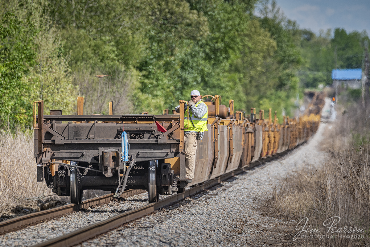 May 11, 2020 - The conductor on CSX J732-11 maintains his three point contact while he calls the crossings as they back their 9,900 ft train of empty container well cars down the Morganfield Branch at Madisonville, Ky for storage, during the slowdown because of the COVID-19 pandemic.

Tech Info: Nikon D800, RAW, Sigma 150-600mm @480mm, f/7.1, 1/1600sec with ISO 500.
