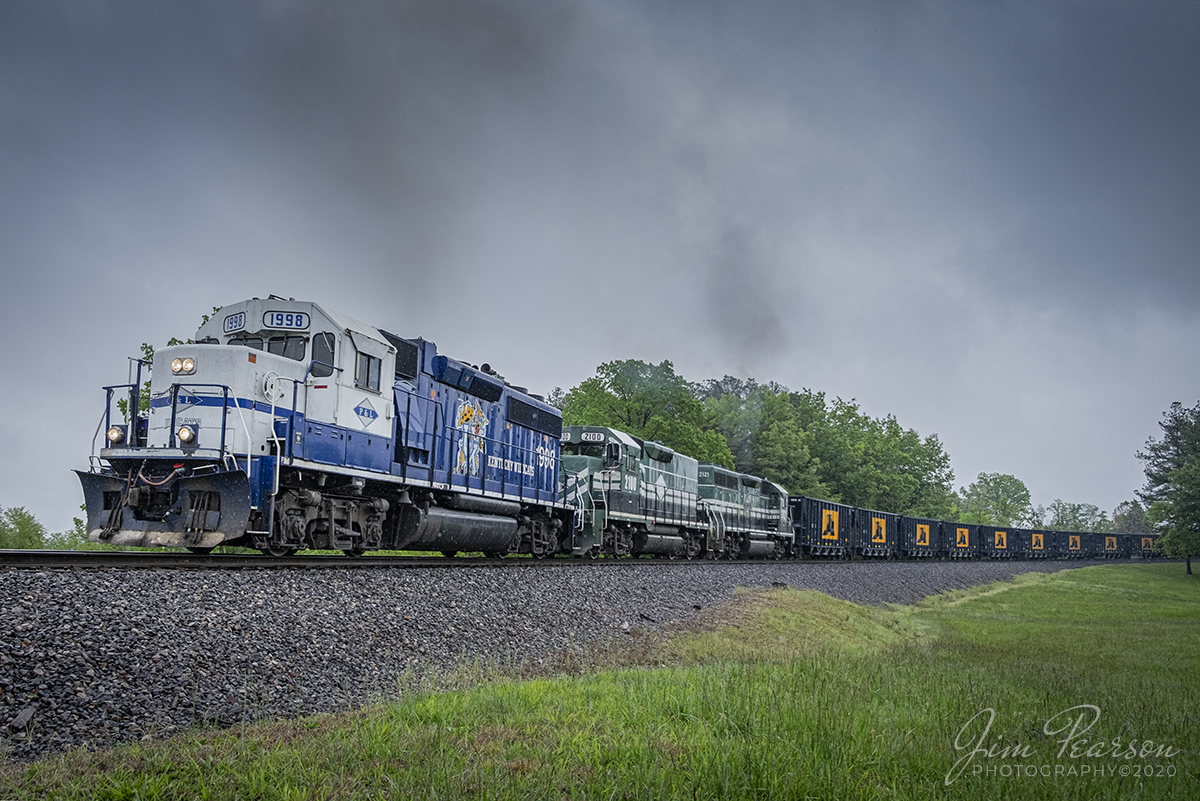 May 13, 2020 - Paducah and Louisville Railway (PAL) 1998, University of Kentucky engine, leads a Scotty's Rock train south on LV1 with PAL 2100 and 2121 trailing. 

The pull at this point is a hard one as they work upgrade out of Litchfield, Kentucky after picking a load of rock cars from Scotty's Contracting & Stone at Litchfield, bound for their Madisonville operation.

Tech Info: Fuji XT-1, RAW, Fuji 18-55mm @ 18mm, 1/1000 sec, f/2.8, ISO 250.