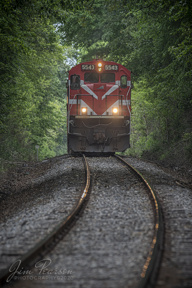 May 15, 2020 - The crew of West Tennessee Railroad (WTNN) Fulton Turn (T92) sit on a rise at as it waits for permission to cross the WTNN/CSX Diamond southbound at Milan, Tennessee with 5543 and 4071 as power.

According to their website: The West Tennessee Railroad began in 1984 on a portion of the former Mobile & Ohio Railroad main line between Jackson and Kenton, Tennessee.  In 2001, the WTNN expanded operations, acquiring operating rights over the former ICG line between Corinth, Mississippi and Fulton, Kentucky.

WTNN operates on a daily basis and has interchanges with CSX, KCS, NS, and CN.  Car storage and transloading services are provided in several convenient areas along the WTNN line.

Tech Info: Nikon D800, RAW, Sigma 150-600 lens @ 370mm, 1/640 sec, f/6.3, ISO 280.