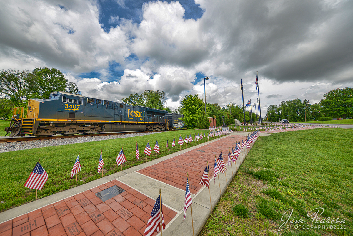 May 21, 2020 - CSXT 3407 brings up the rear of CSX Q502 as the DPU, as it passes the Veteran's Memorial Park at Madisonville, Ky as it heads north on the Henderson Subdivision. 

Tech Info: Nikon D800, JPG processed as RAW, Irex 11mm, f/4, 1/640th, ISO 100.
