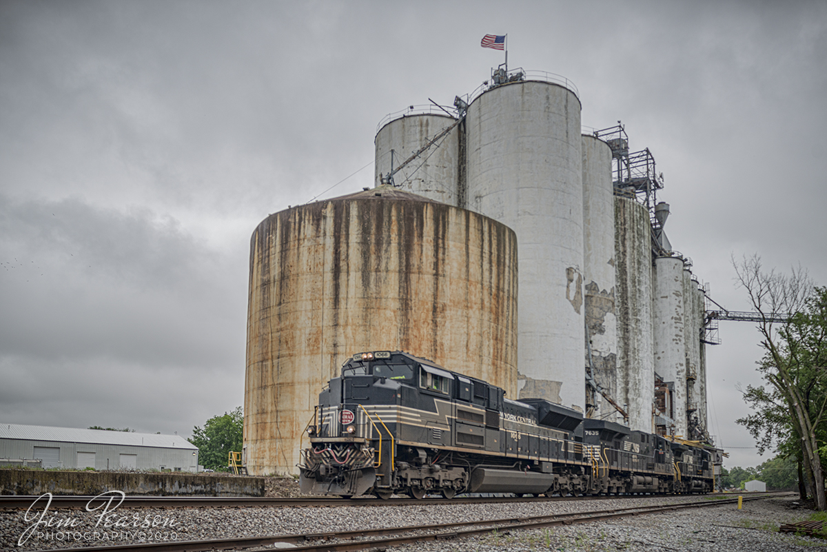 May 27, 2020 - Norfolk Southern New York Central heritage unit 1066 passes Consolidated Grain & Barge Co. silos at Wayne City, Illinois as it heads west on the NS Southern-West District. It was running engine light, with two other engines in trail, as NS D51as it headed down the line to pick up empty grain cars. 

This was one of of the last three NS Heritage units that I haven't caught till now, so only 2 left till I've photographed all 20 of the NS Heritage fleet. Now I need to catch the Savannah & Atlanta Railway and the Pennsylvania Railroad to complete my NS Heritage picture set.  

Tech Info: Nikon D800, RAW, Sigma 24-70 @ 24mm, f/5.6, 1/640sec, ISO 125.
