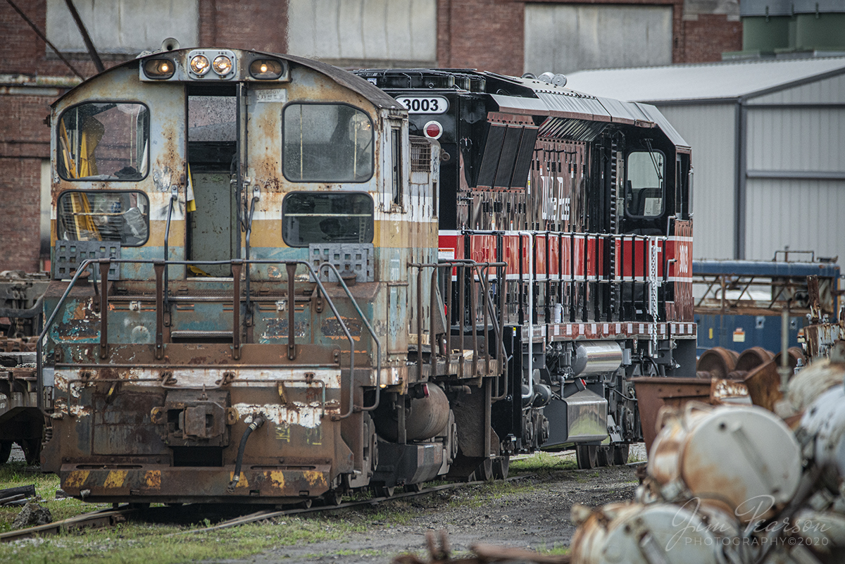 May 27, 2020 - Not a real clear shot of it, but today I found White Pass 3003, one of six new locomotives for the White Pass & Yukon Route, attached to an old switcher at National Railway Equipment Company in Mount Vernon, Ill.

According to CBCNEWS, the Scenic railway out of Skagway, Alaska, is replacing their 50-year-old locomotives with these new units.

"The White Pass & Yukon Route scenic railway runs every summer on the 110-kilometre historic route between Skagway and Carcross, Yukon.

The new locomotives will replace the railway's aging fleet of locomotives from the 1960s. They're built by National Railway Equipment Company in Mount Vernon, Ill."

I'd love to catch this power move when it happens, so if anyone knows when it'll happen I'd love a heads up!

For me the old switcher is just as interesting as it has, what appears to be, Chinese writing on the voltage plate under the right light. Anyone know anything about it? I wasn't able to get a good side shot of it while I was there, so I don't have a number.