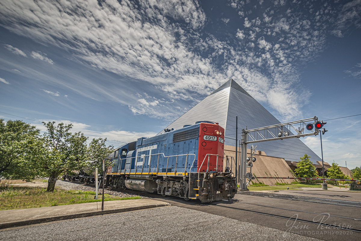June 2, 2020 - This is one of my favorite shots from a 5 state, 22hr railfan trip, with fellow railfan Ryan Scott! This is a Canadian Nation local running long hood forward as it passed the iconic Memphis Pyramid with Grand Trunk 4917 at the North Parkway crossing in downtown Memphis, Tennessee. We just barely made it to this crossing before it showed up! 

Although there was a work curfew at the diamond in downtown, which affected the traffic, we both came back with a nice set of pictures! A big shout out goes to the folks on the Memphis Railfans Group for their help!!

We departed my house at 4am in the morning and railfanned through Kentucky, Tennessee, Arkansas, Missouri, and Illinois over a span of the 22 hours. A long, but very productive trip for us both. Look for more images to come over the next few weeks!

According to Wikipedia: The Memphis Pyramid, initially known as the Great American Pyramid, formerly referred to as the Pyramid Arena and locally referred to as The Pyramid, the Tomb of Doom and the Bass Pro Shops Pyramid, was originally built as a 20,142-seat arena located in downtown Memphis, in the U.S. state of Tennessee, at the banks of the Mississippi River.

Tech Info: Nikon D800, RAW, Irex 11mm, f/4, 1/3200sec, ISO 140.